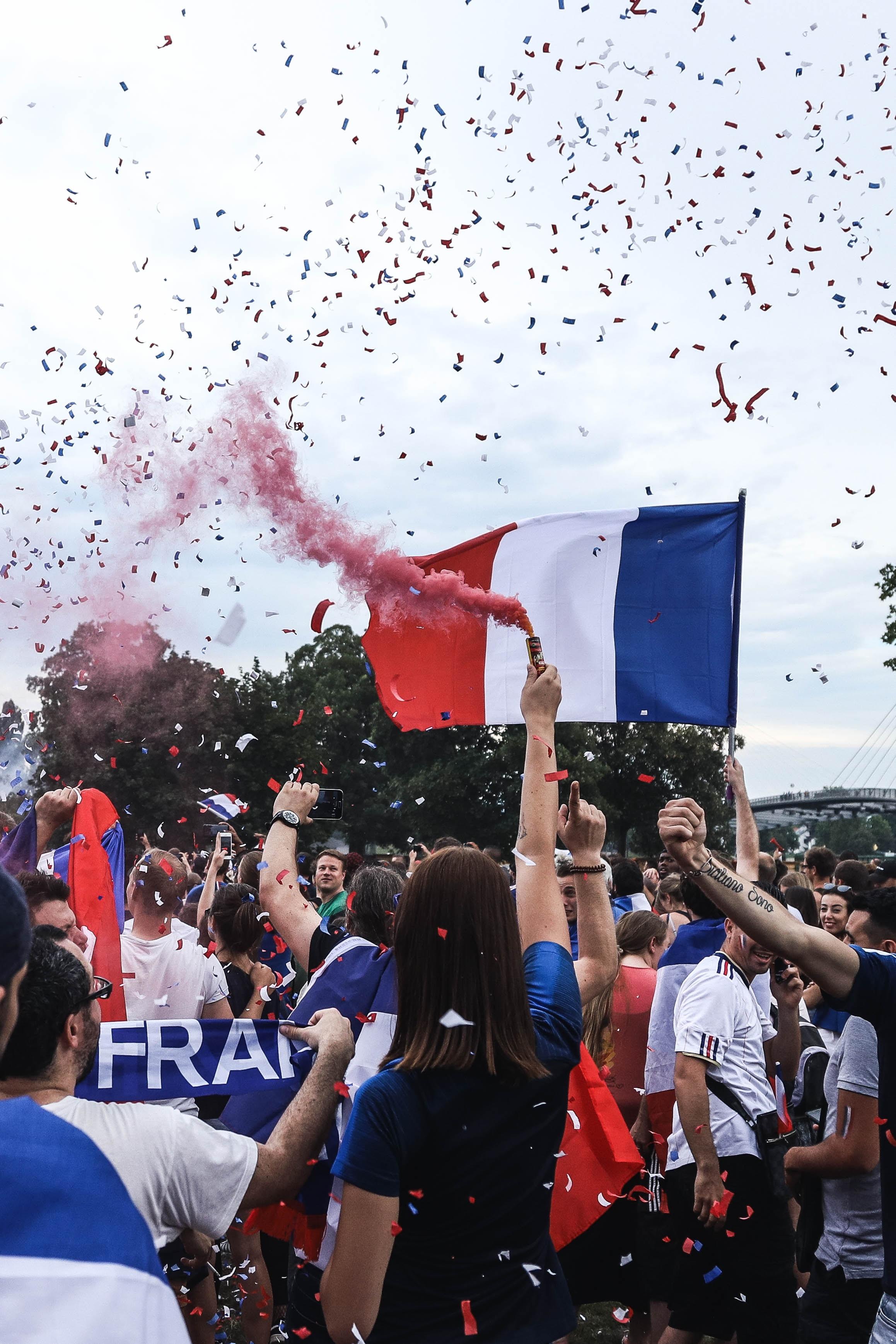 french flag above a crowd