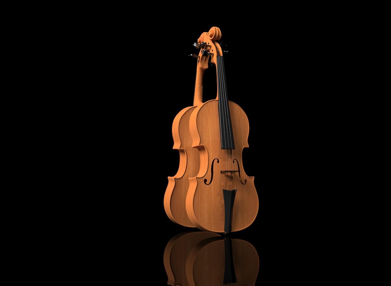 A violin standing upright against a black background