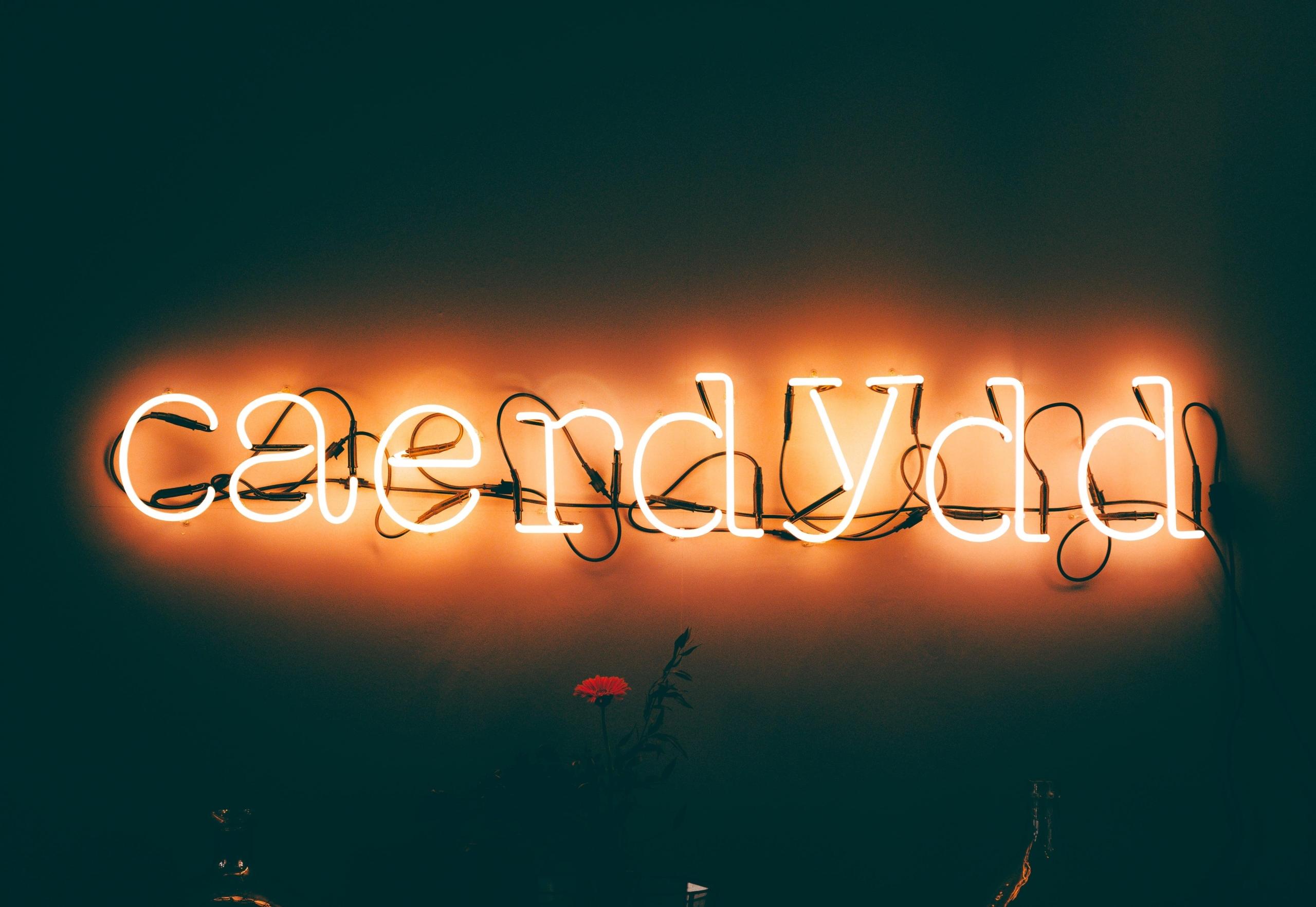 neon signing reading Cardiff in Welsh