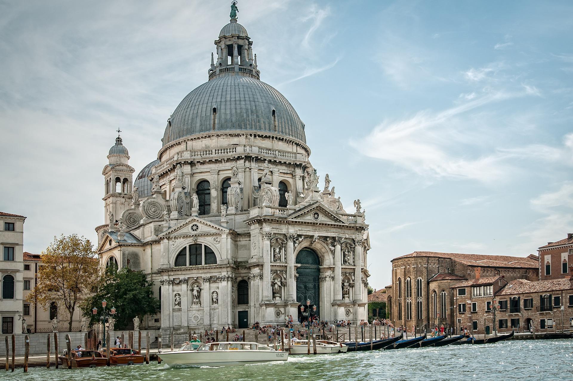 How can you find hotels and hostels in Venice?