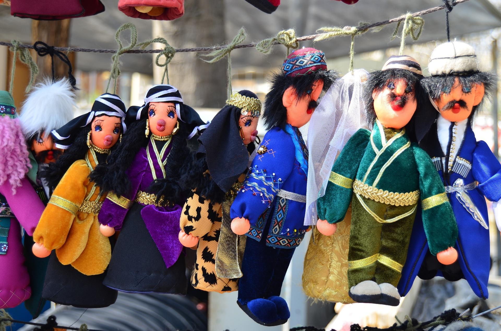 How do you embroider eyes onto dolls?