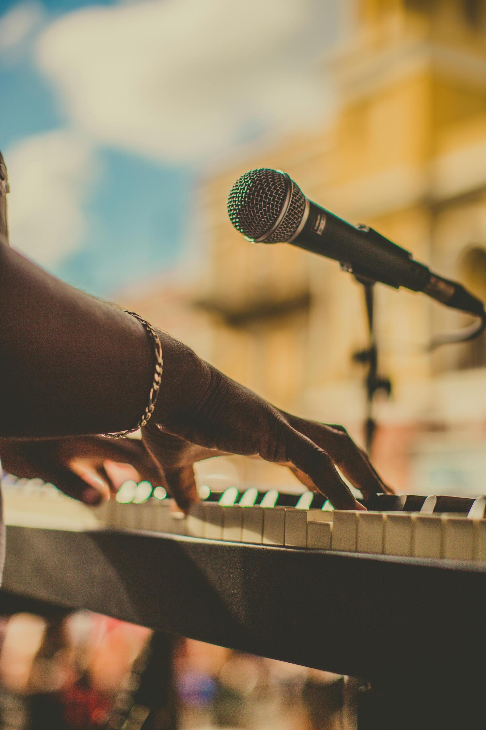 Person playing the piano with focus and emotion.