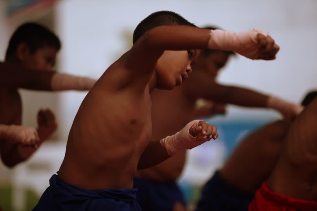 Children learn footwork and punching early in Thailand