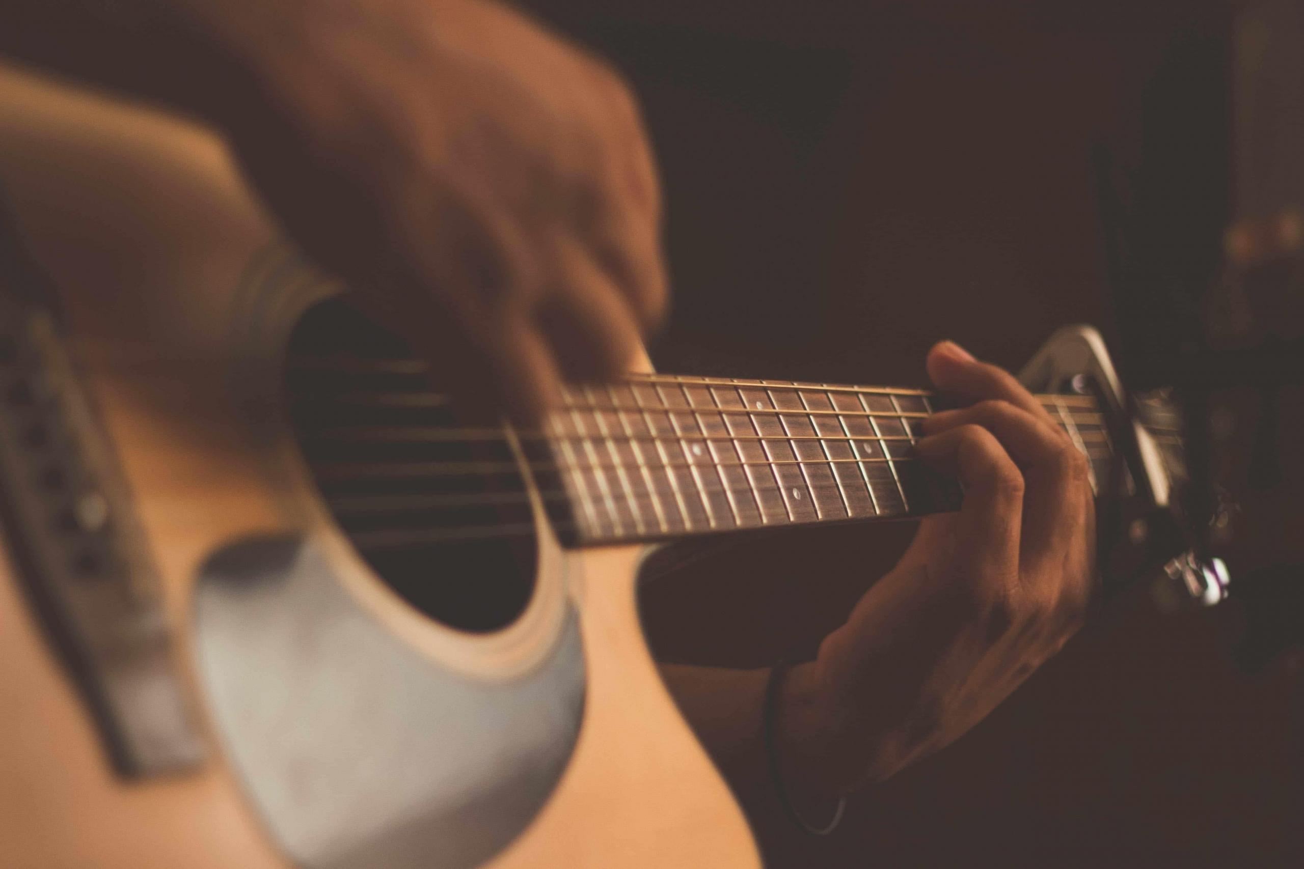 Someone playing guitar