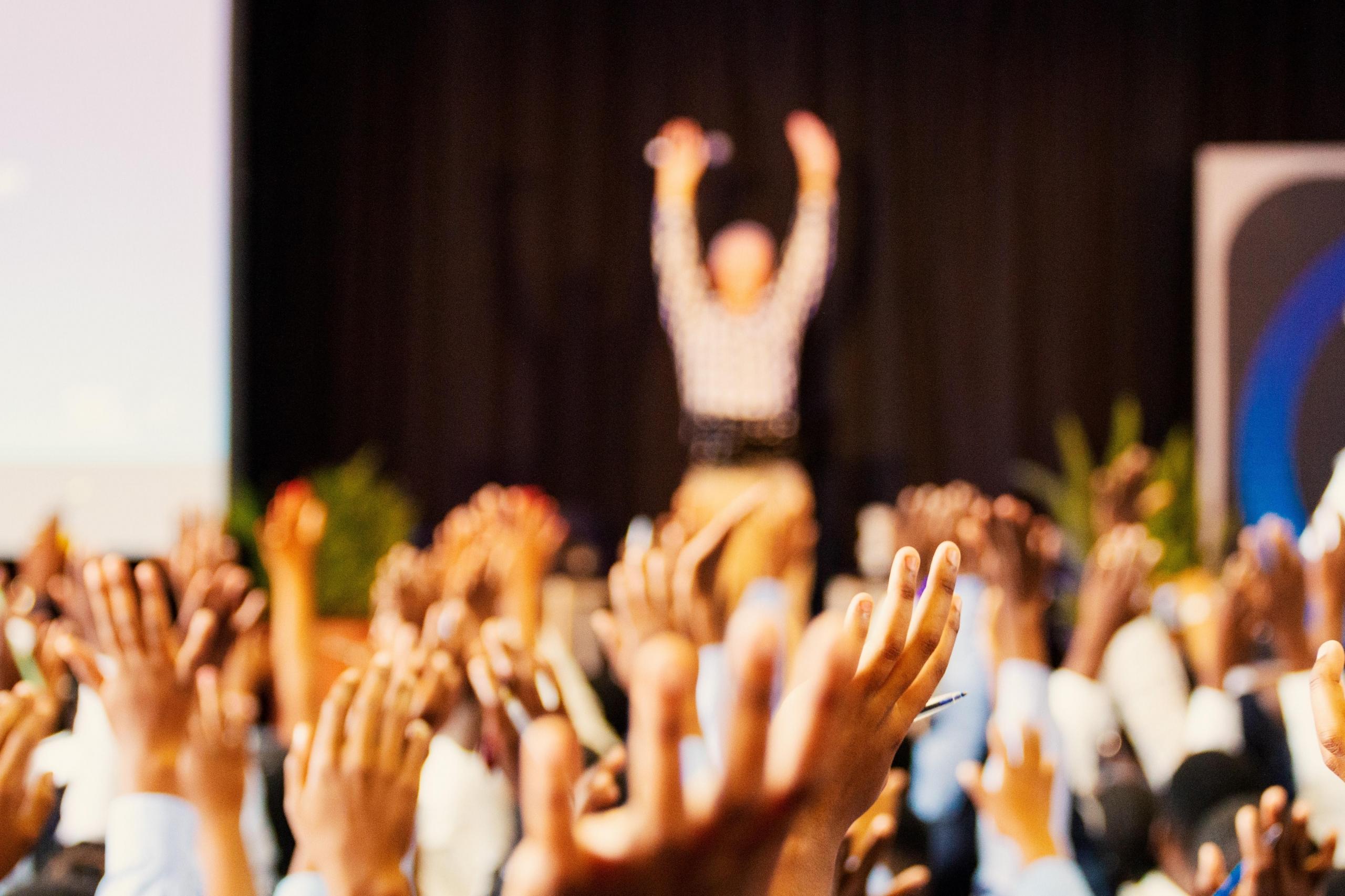 students raising their hands