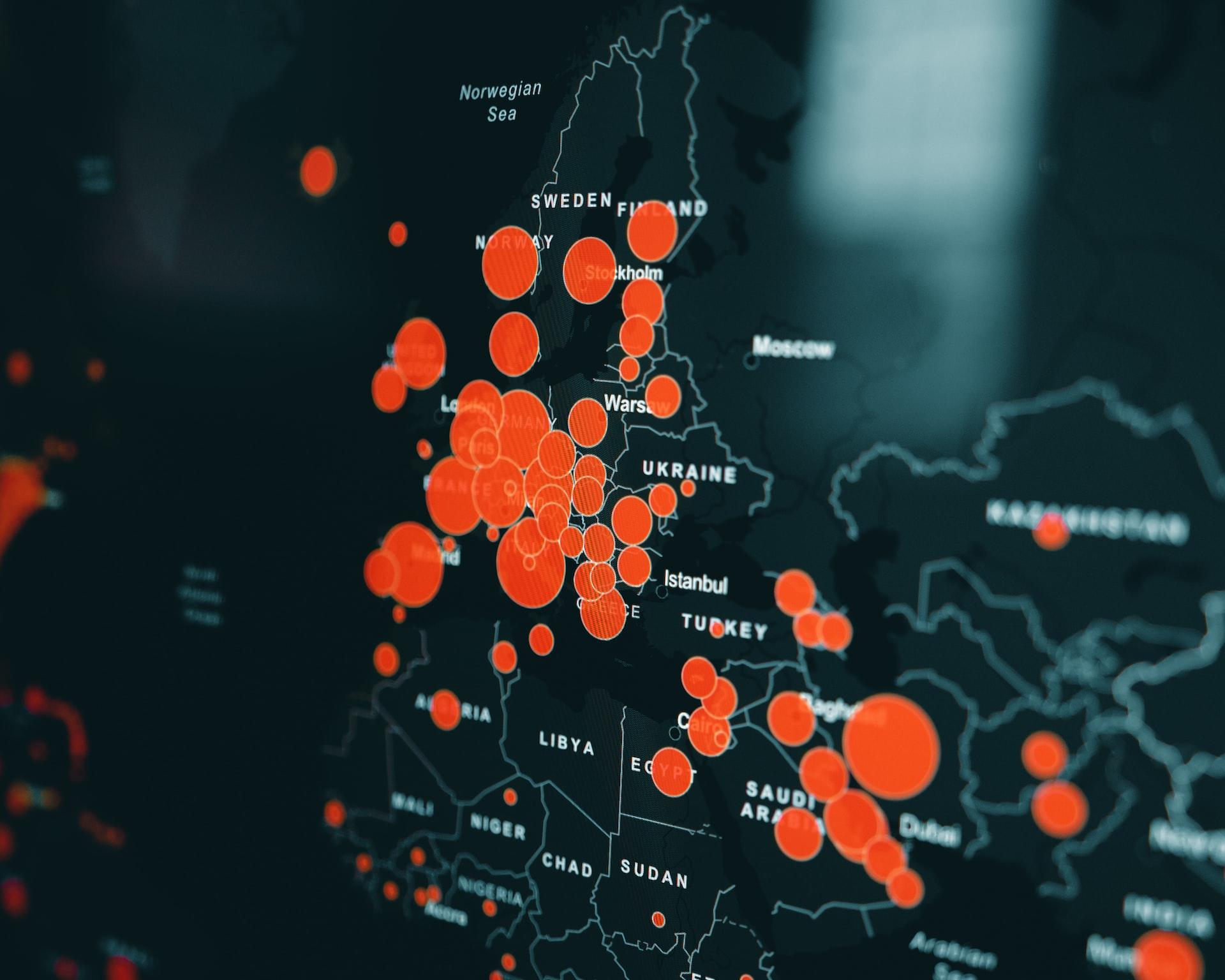 A map of Europe and Northern Africa marked out in white lines against a dark background with red dots noting infection centres