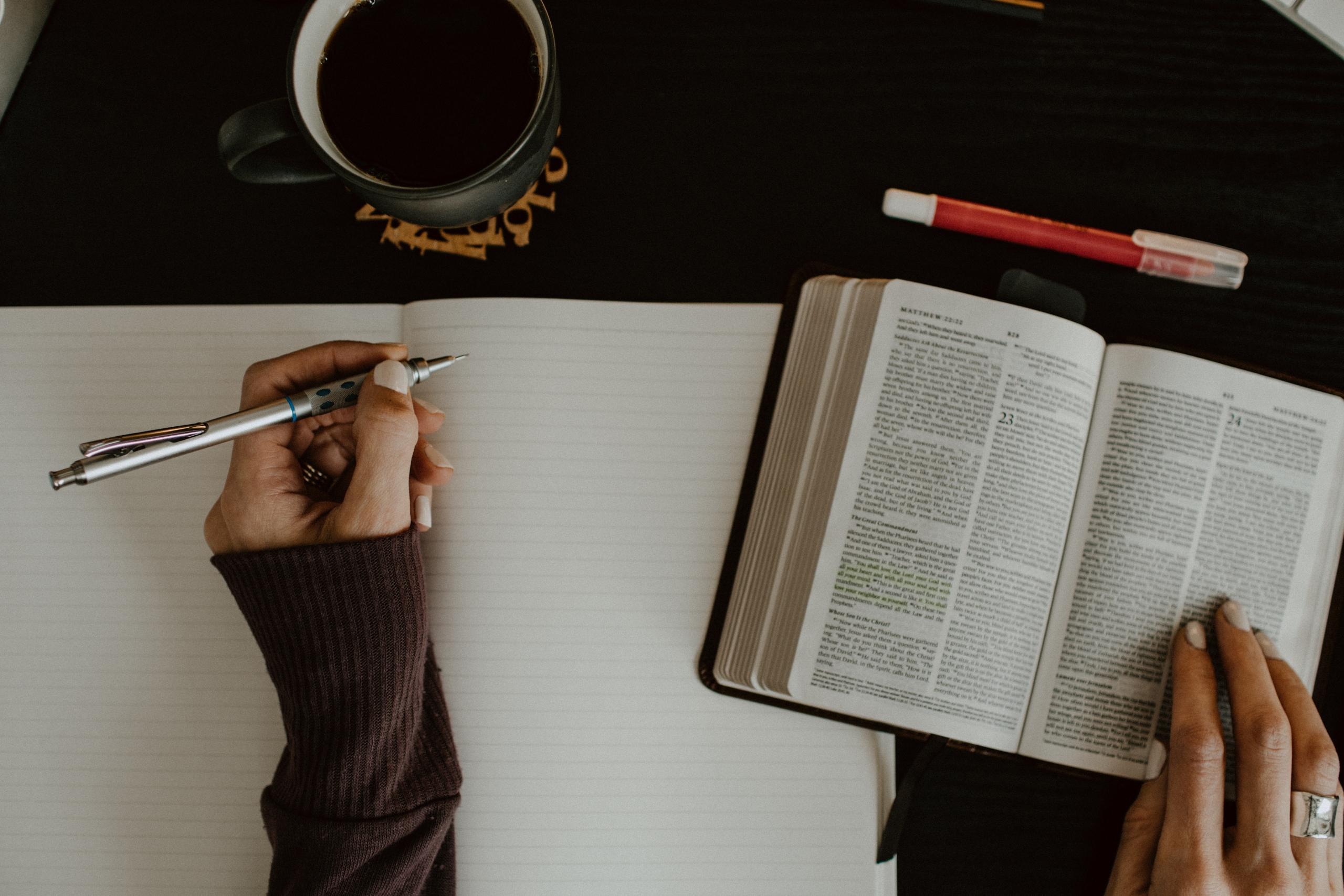 Book and a person writing