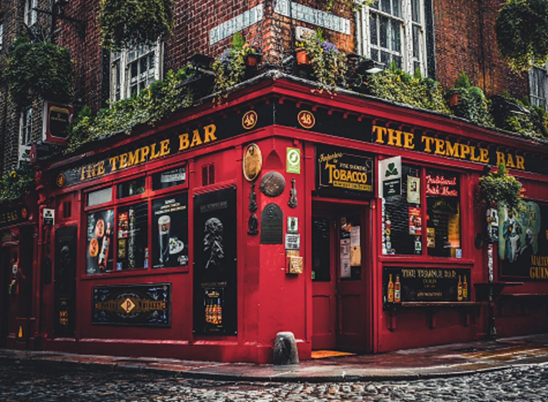 A corner building with a red facade