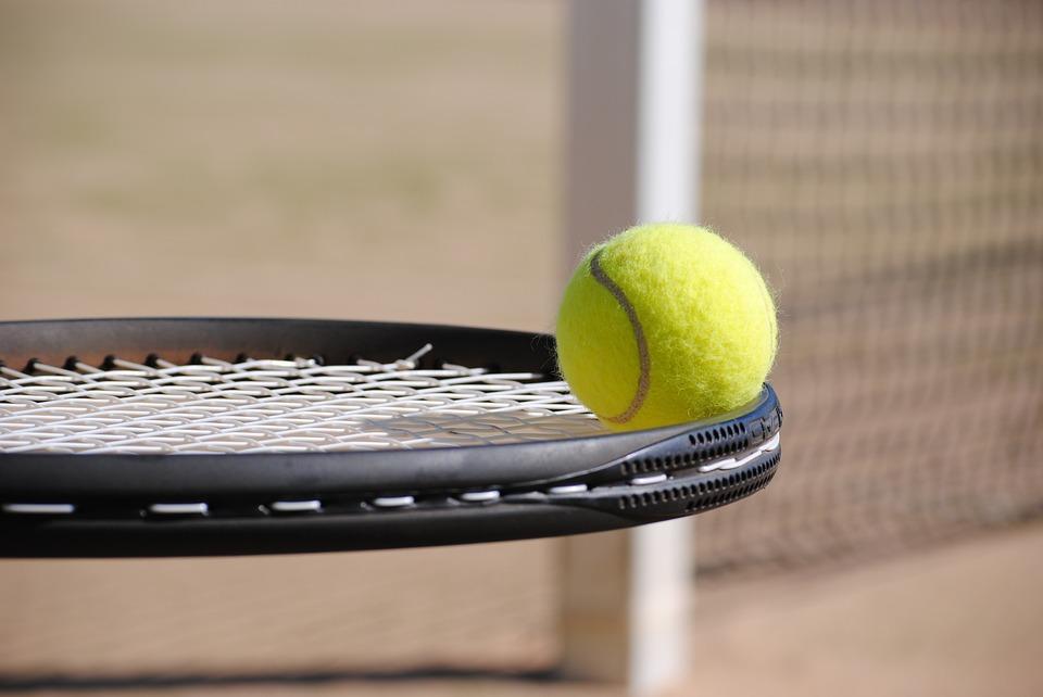 A tennis racket and a ball