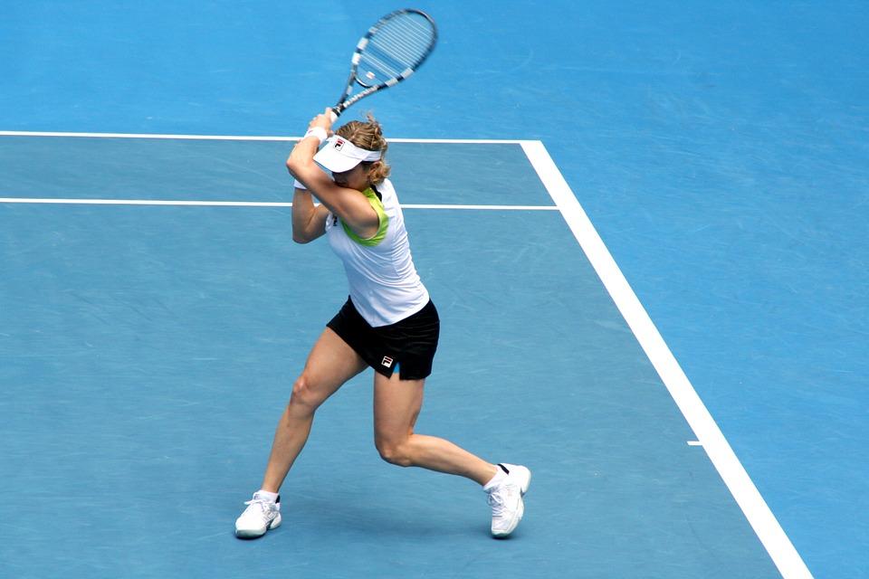 A female tennis player looking to strike the ball to the other side of the court