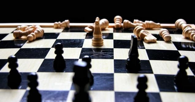 Chessboard with scattered pieces