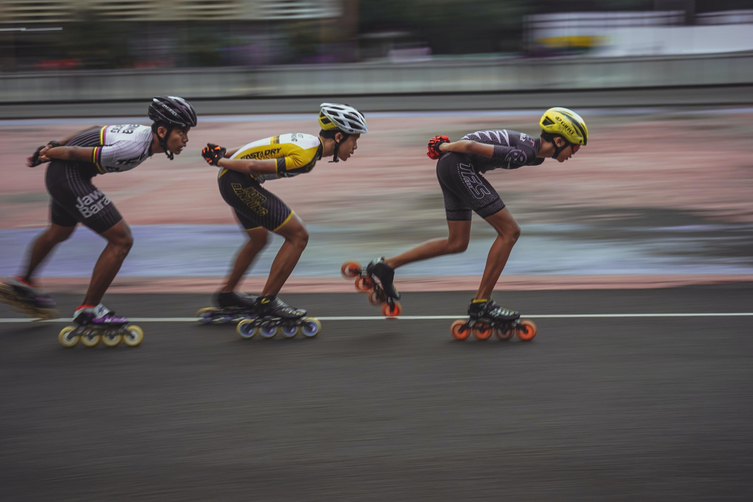 three roller skaters