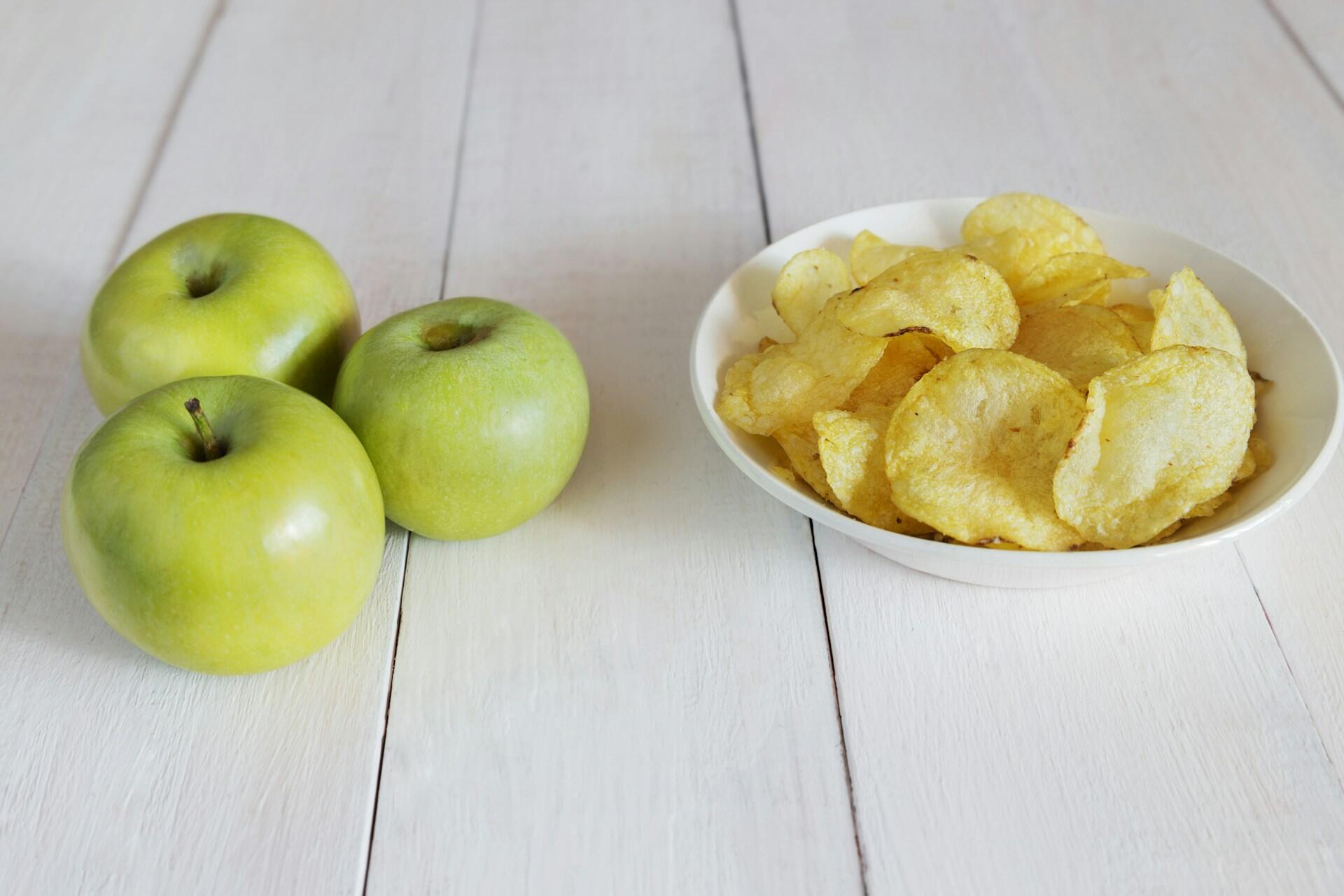 Apples next to crisps.