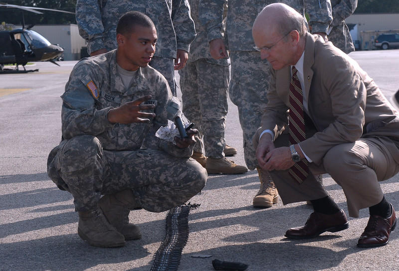This army secretary shows great posture even when squatting down.