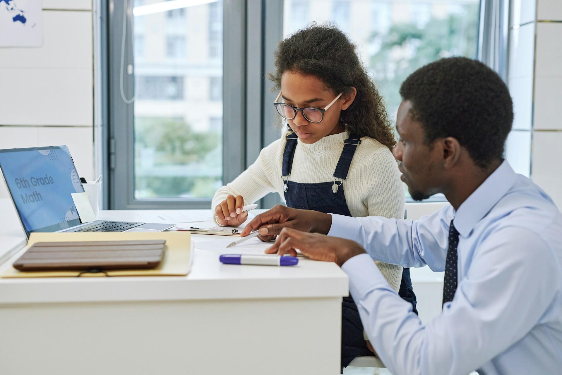 A tutor and pupil during a session.