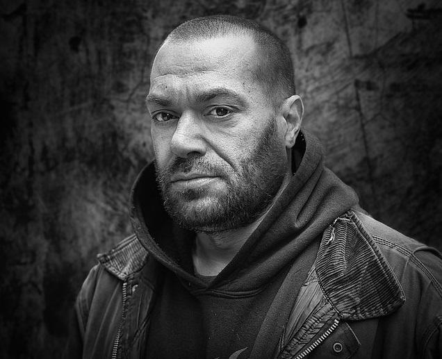 A hoodie worn under the jacket is a current fashion trend.