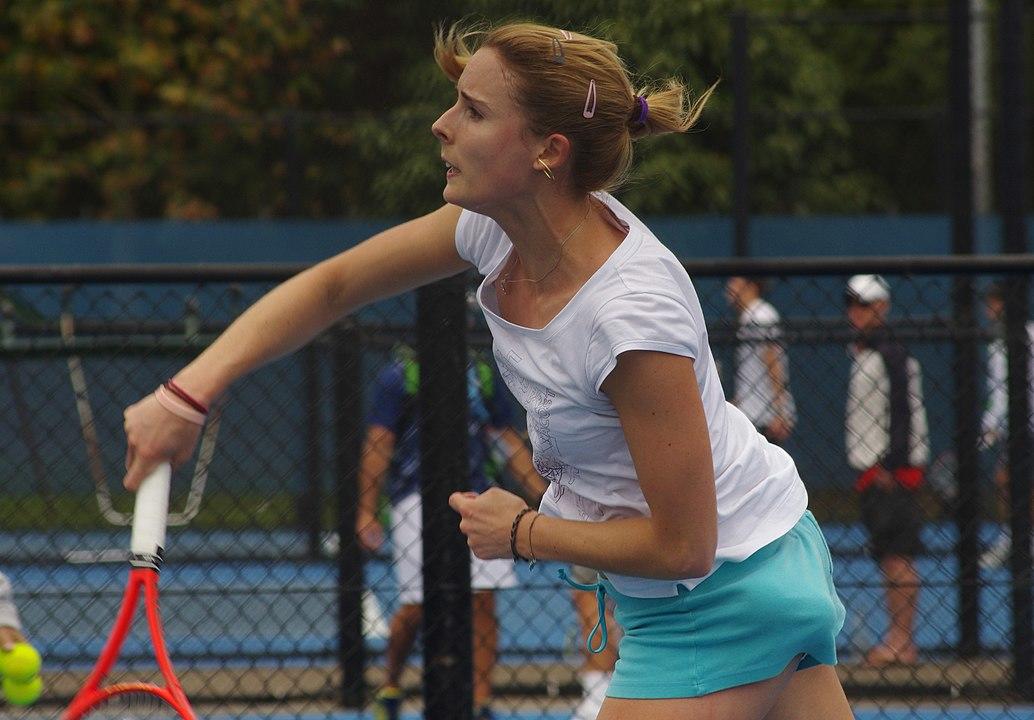 Ms Cornet took a few seconds to fix her shirt