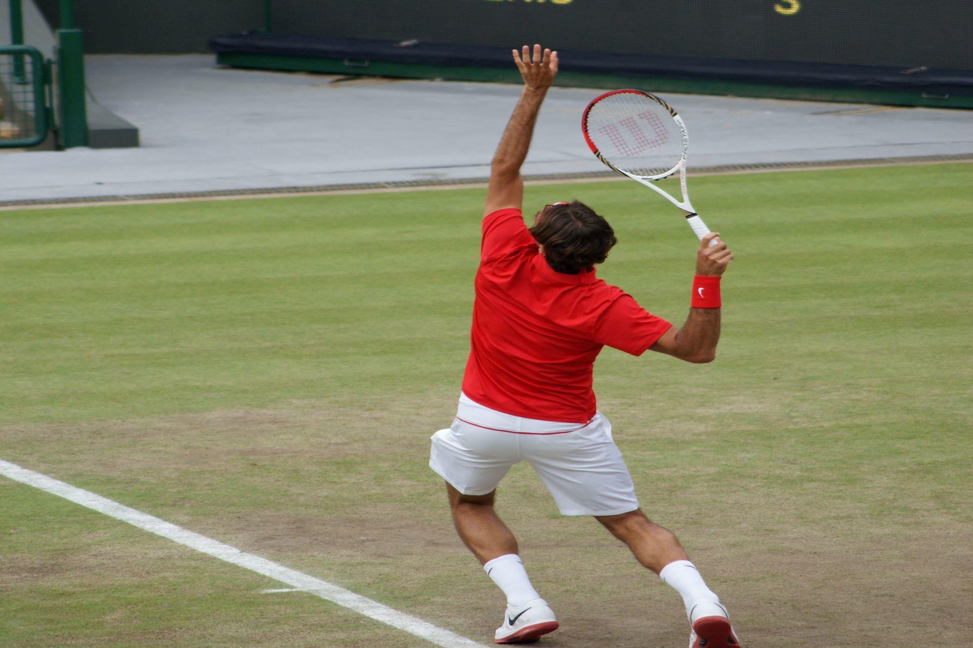 A tennis player serving the ball.