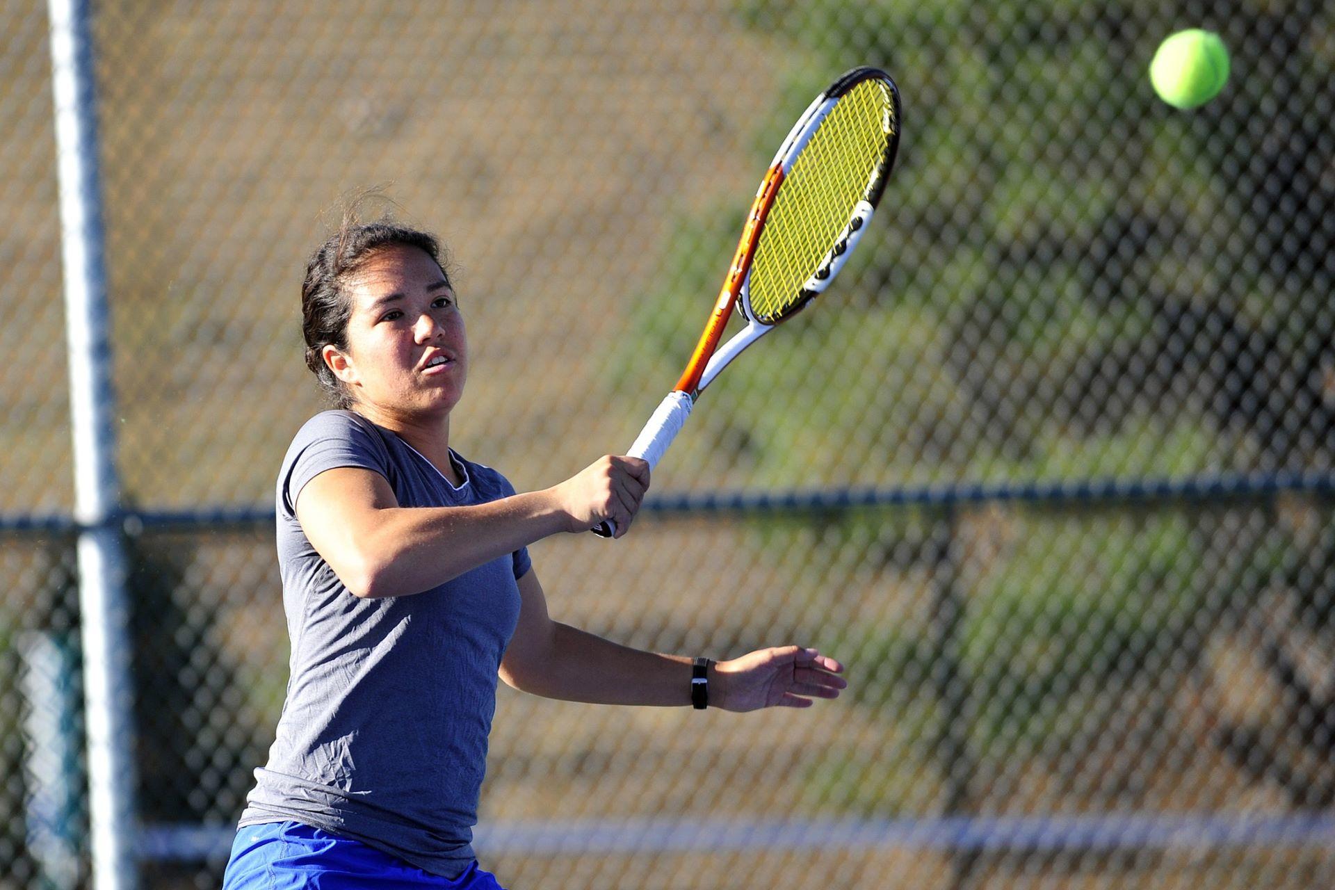 A tennis player serving the tennis ball