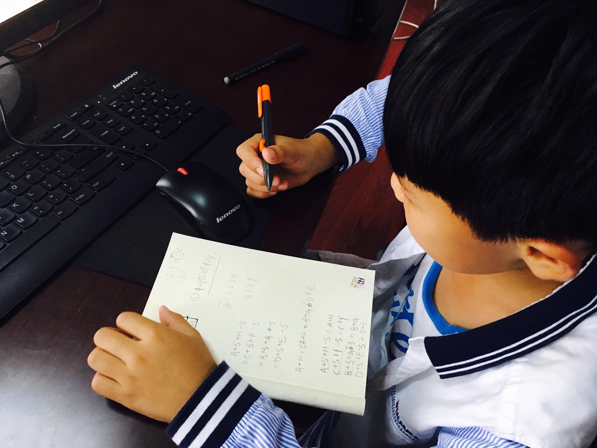 Child taking notes