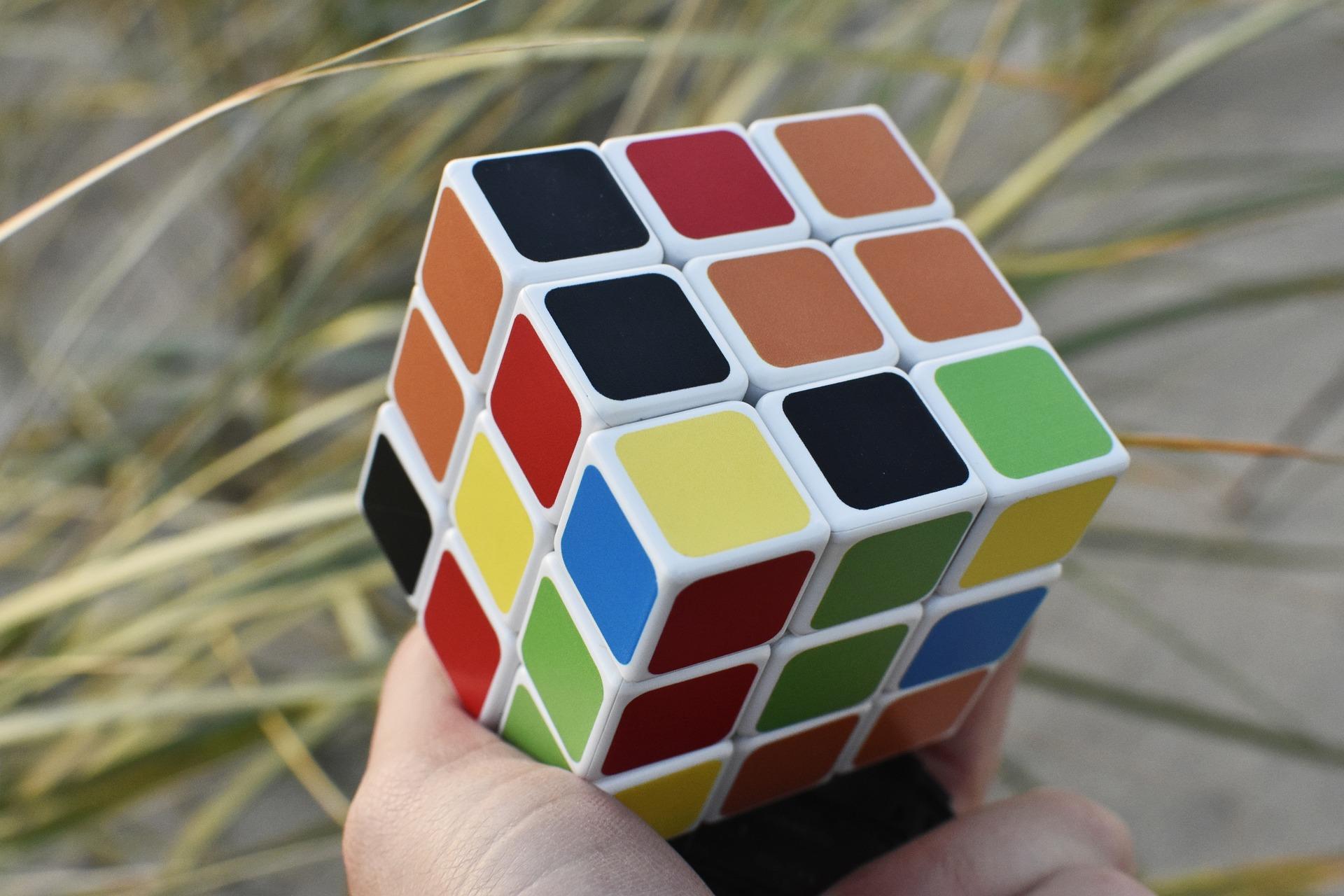 Someone holding a Rubik's Cube outside