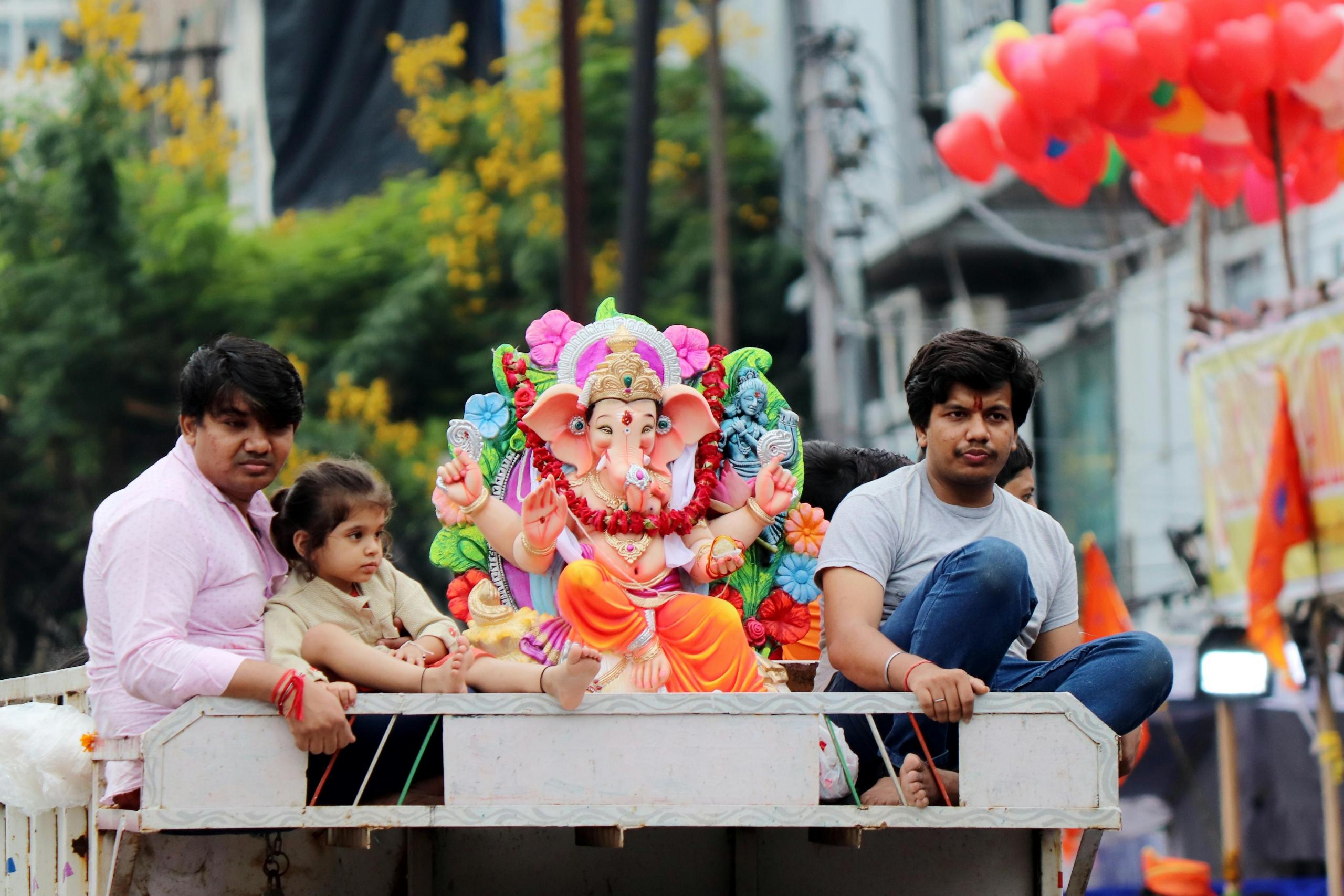 A parade taking place in a city in India.