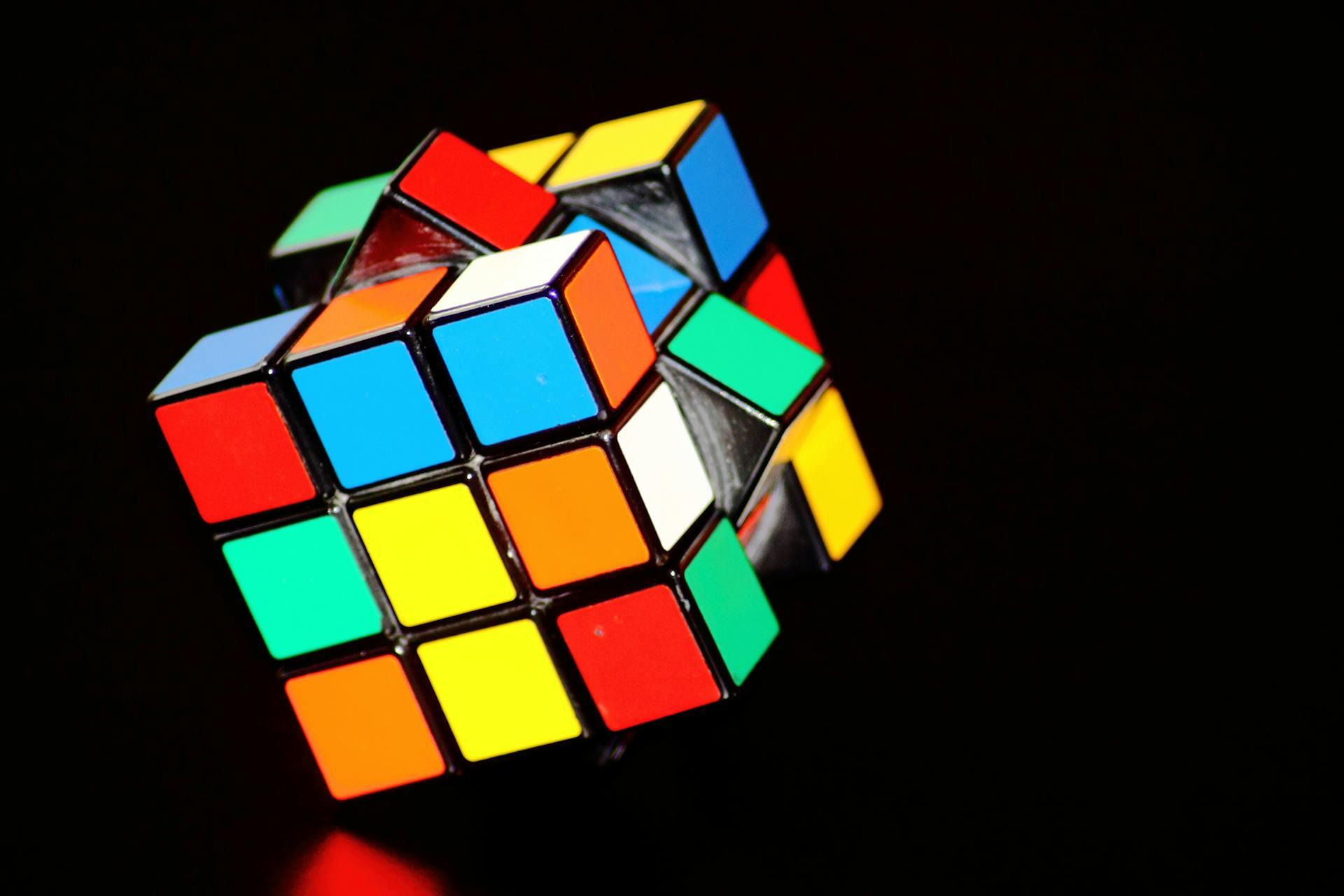 a rubik's cube against a black background
