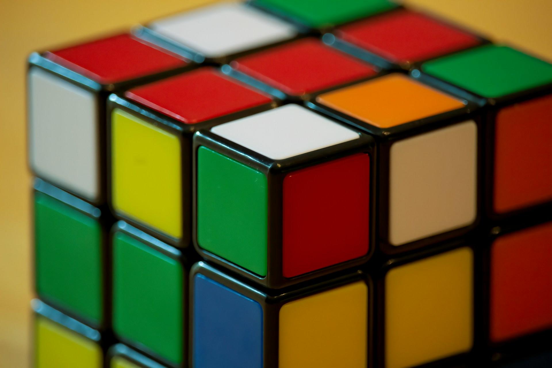 A closeup of an unsolved Rubik's Cube.