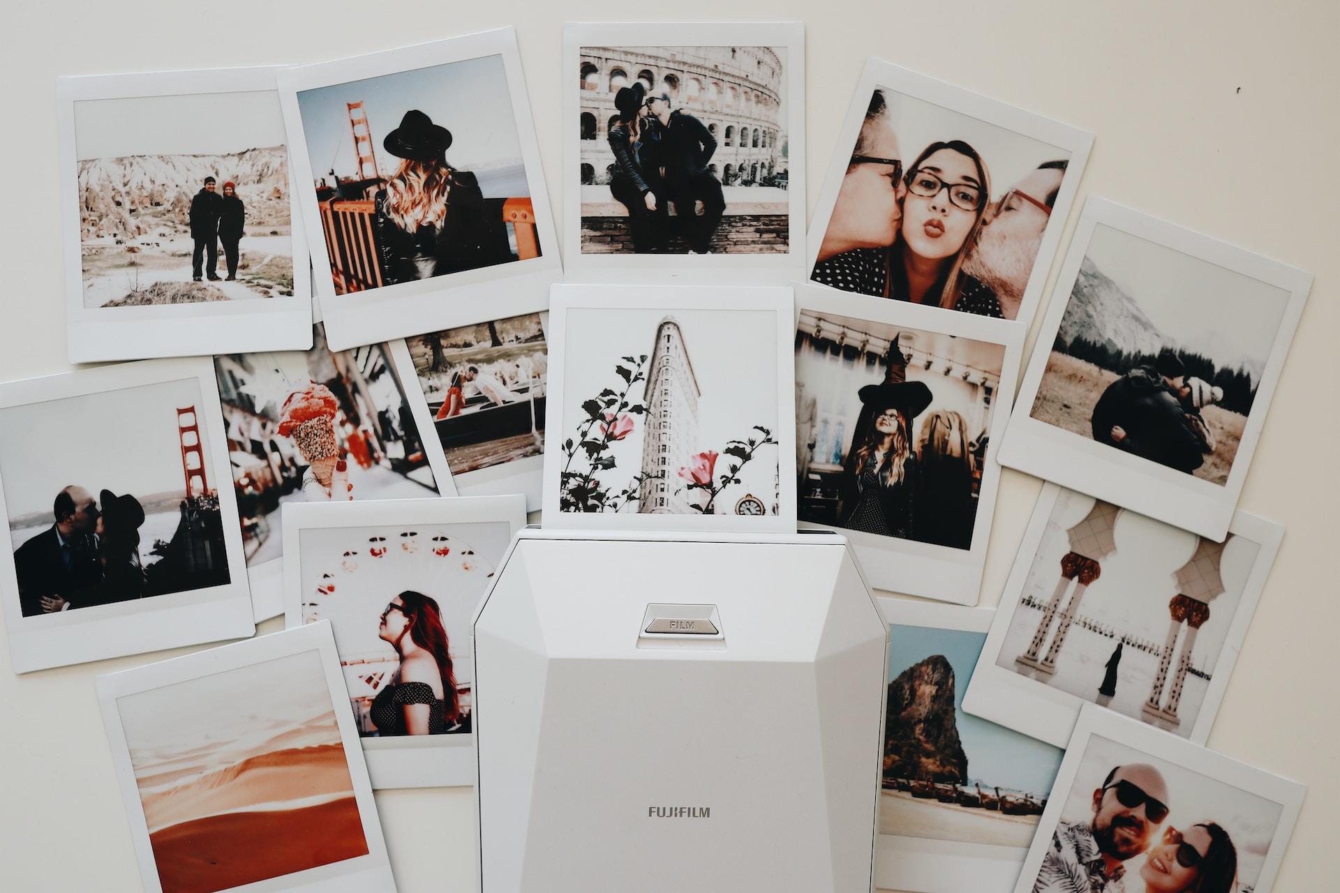 Several Polaroids laid out on a table.