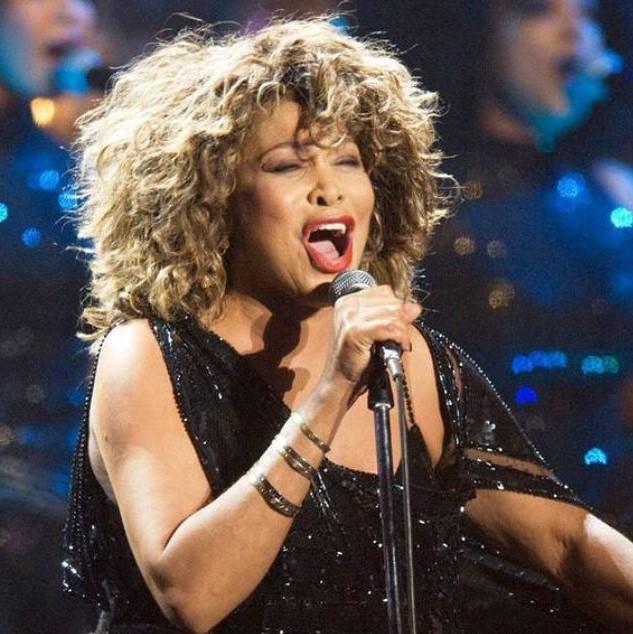 Tina Turner singing into a mic.