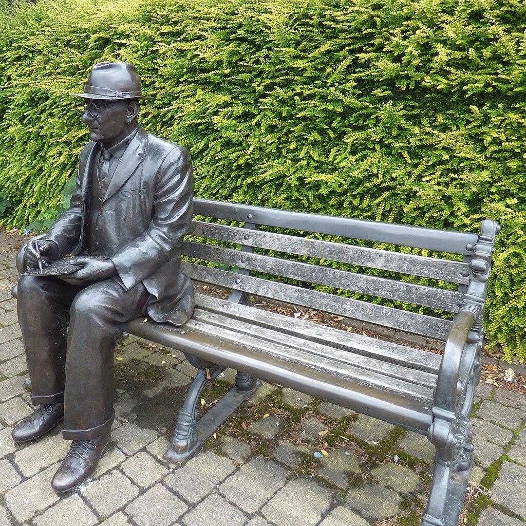 LS Lowry statue on a bench
