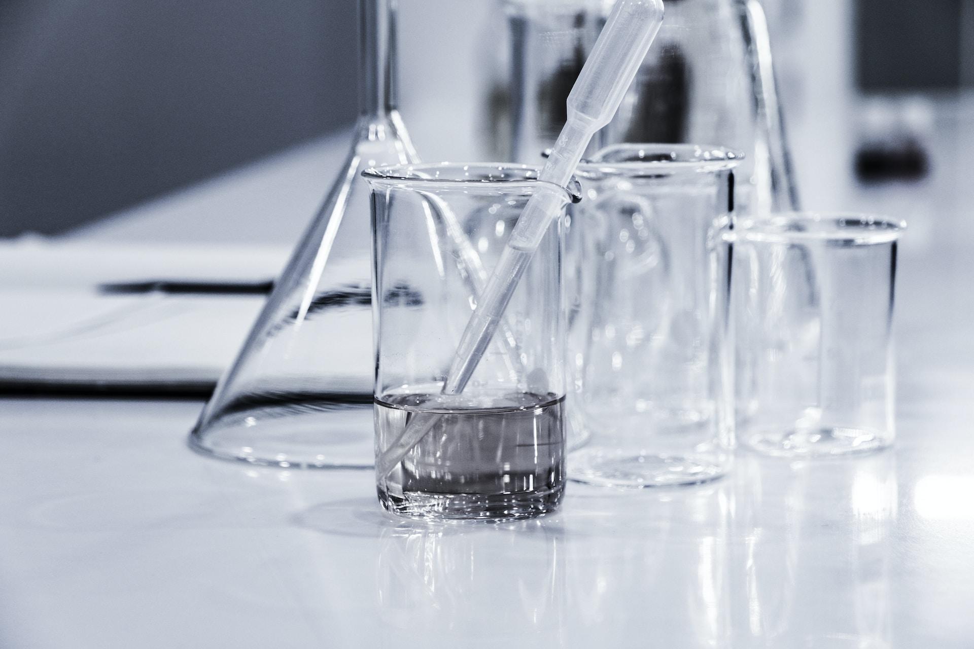 Clear beakers and scientific glassware.
