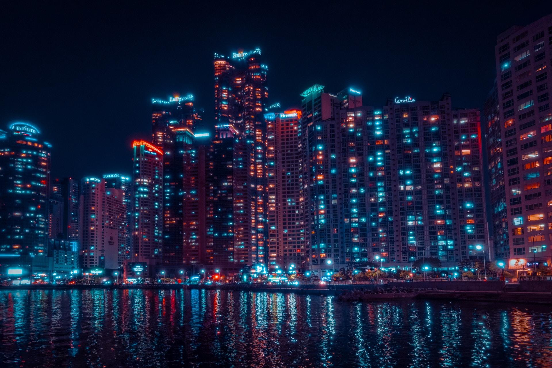 A view of buildings at night in Busan, South Korea.