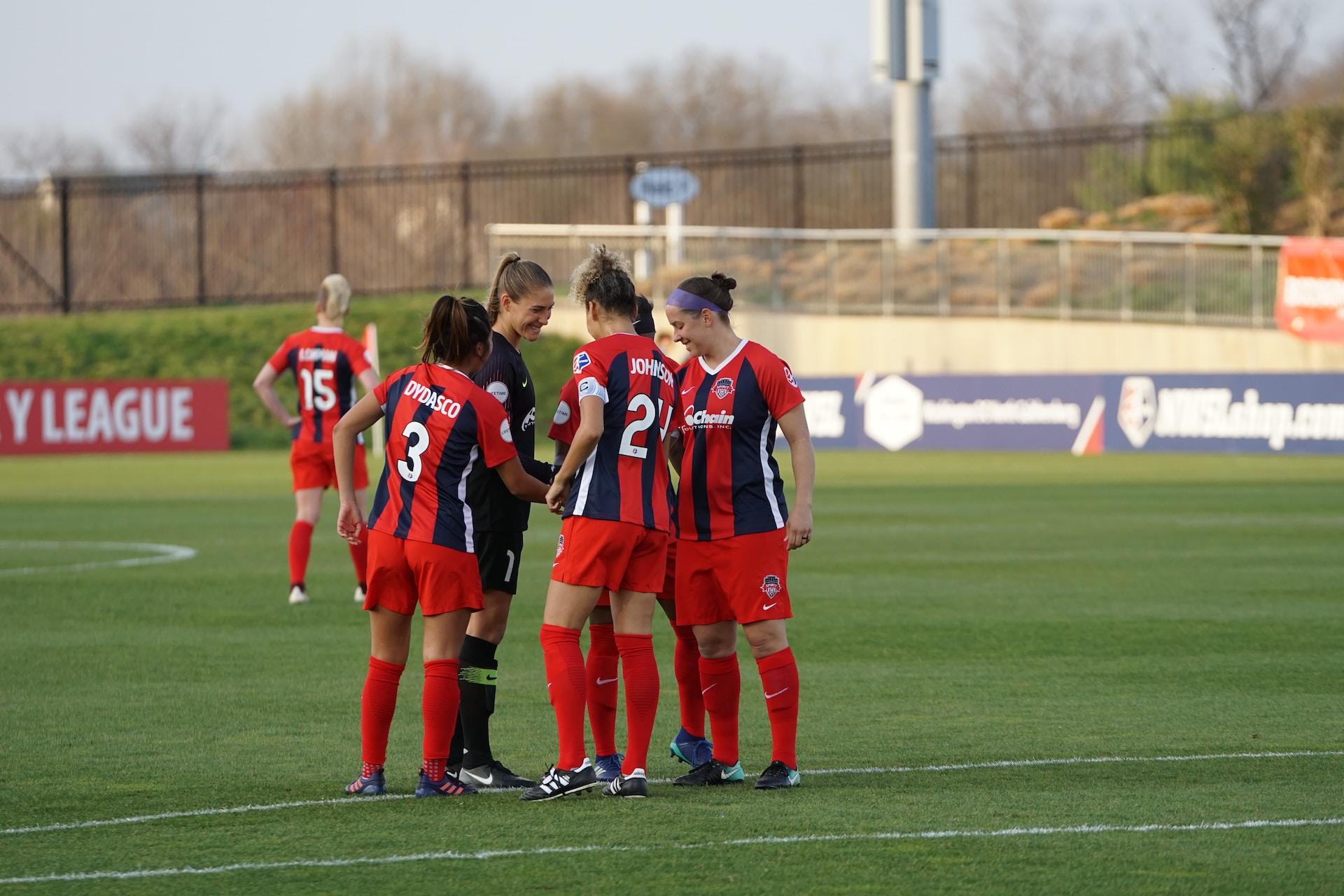 A women's soccer team on the pitch.