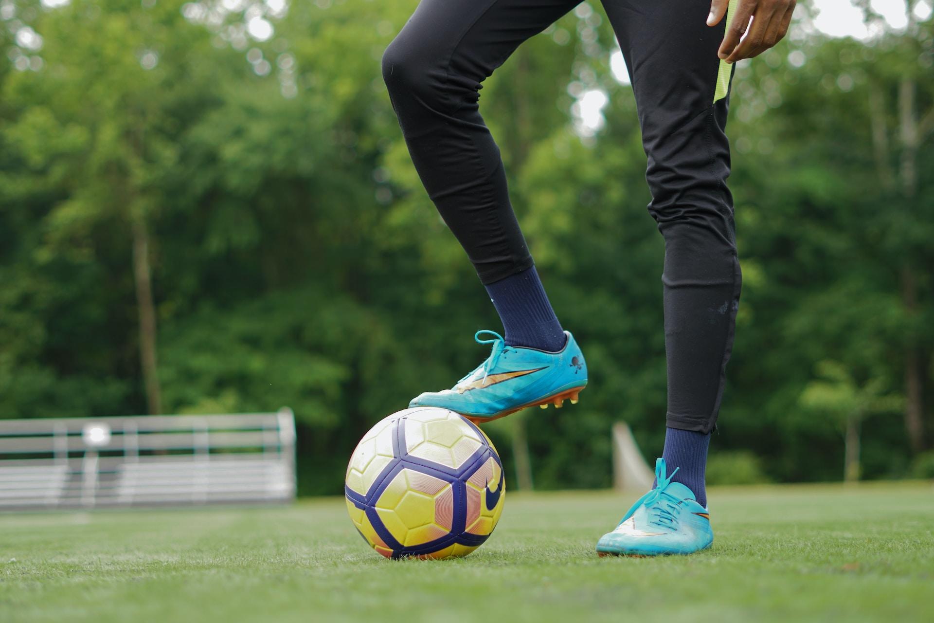 A foot on a soccer ball.