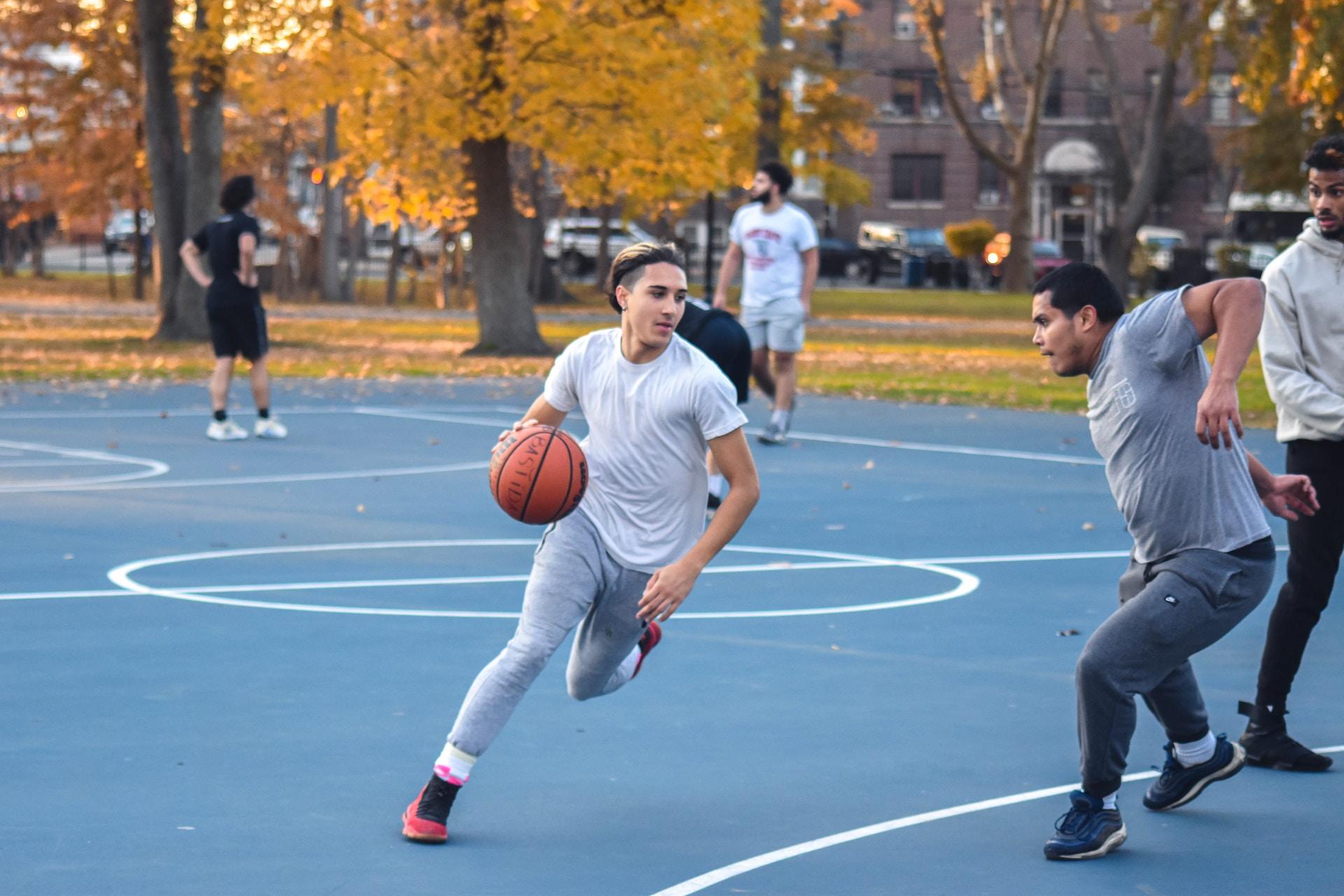 A basketball player running with the ball.