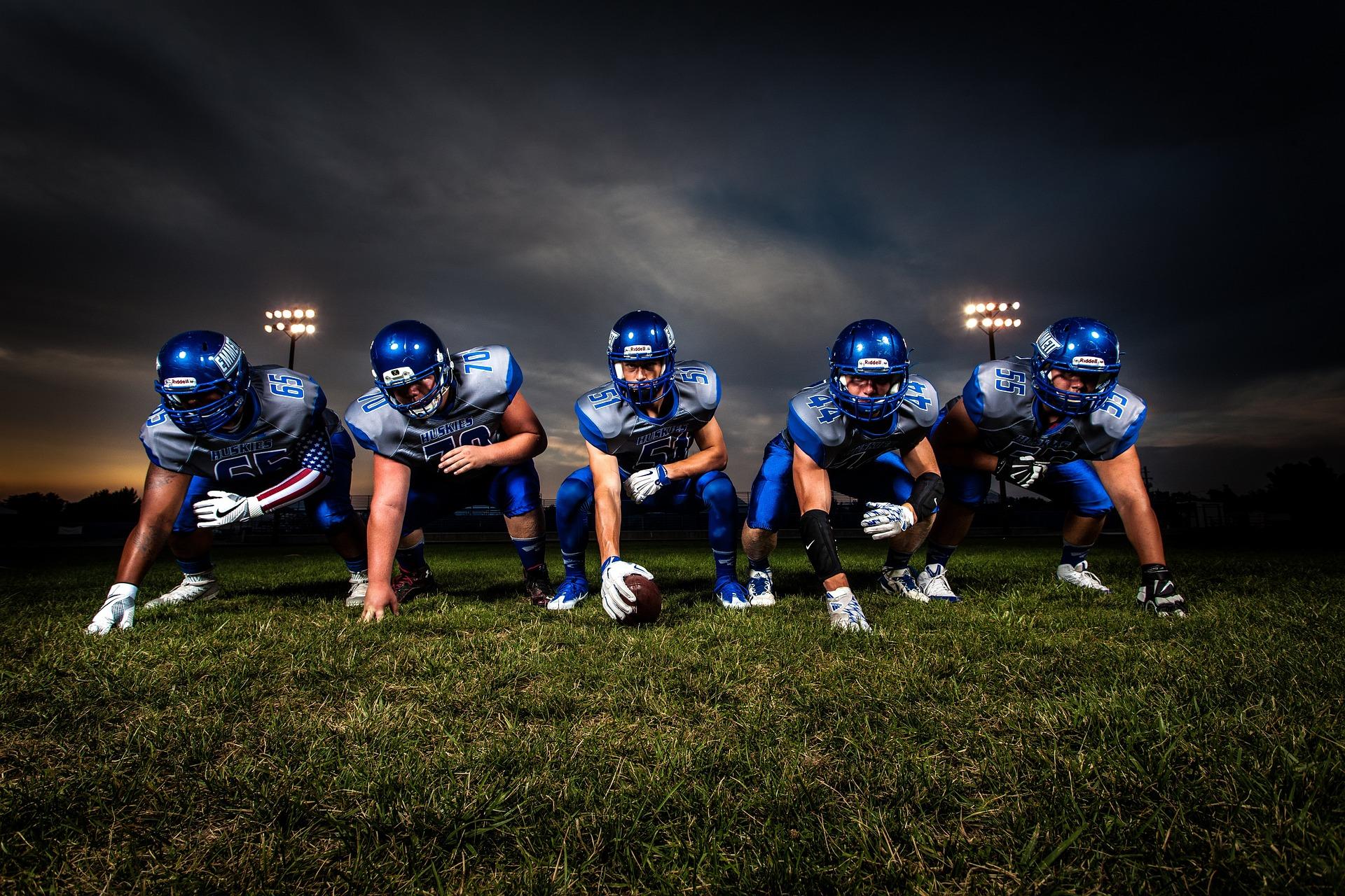 A football team taking their positions
