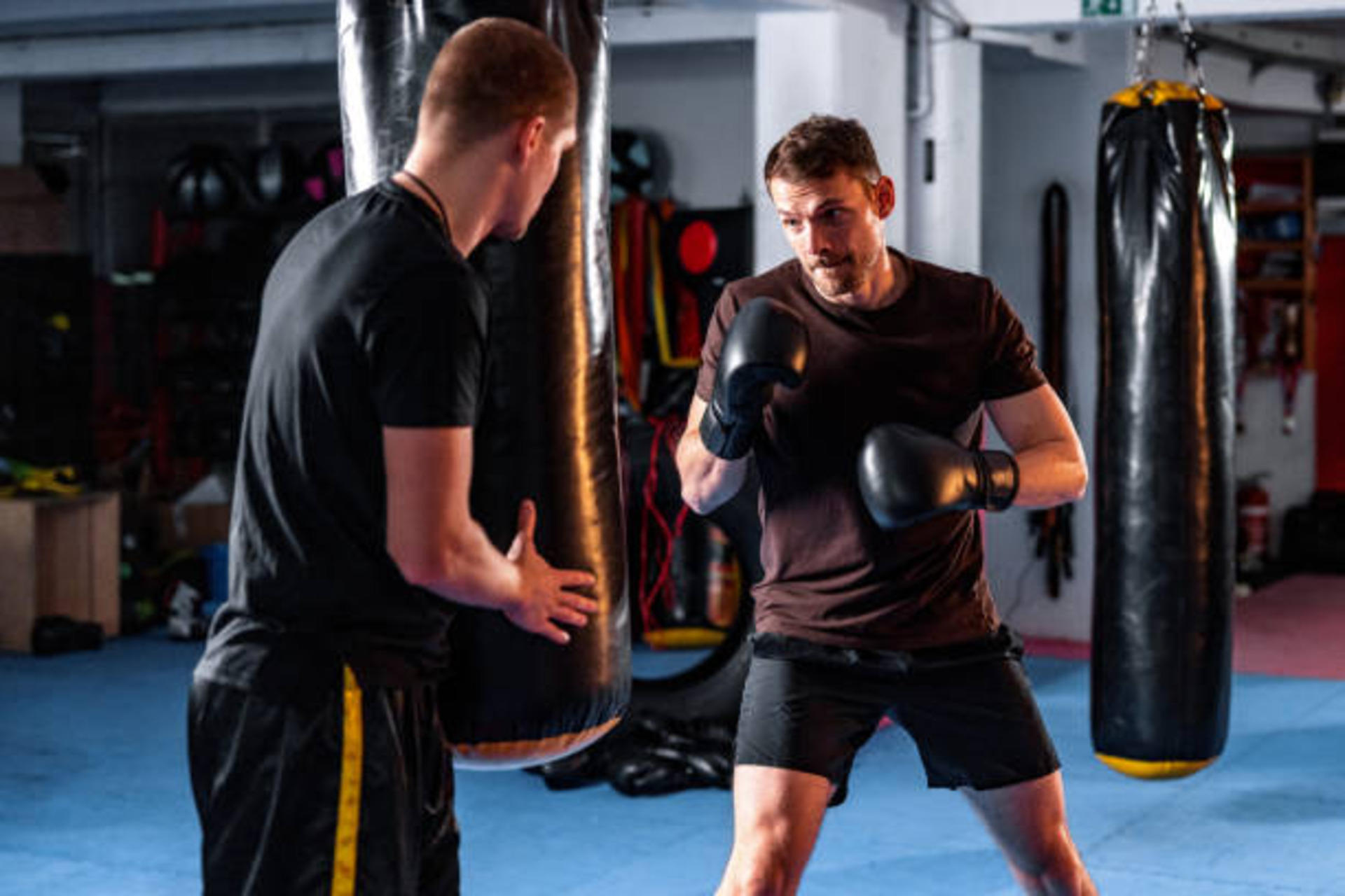 A boxer getting training in a boxing club.