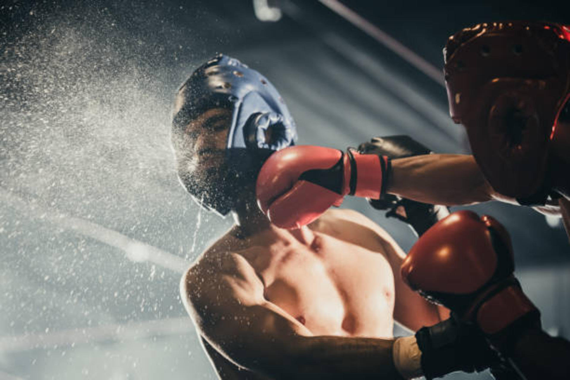 A boxer punched by his opponent.