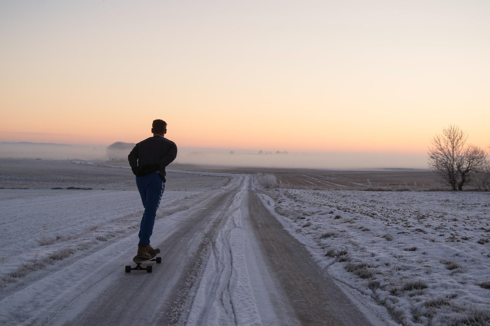 A longboarder on a track.
