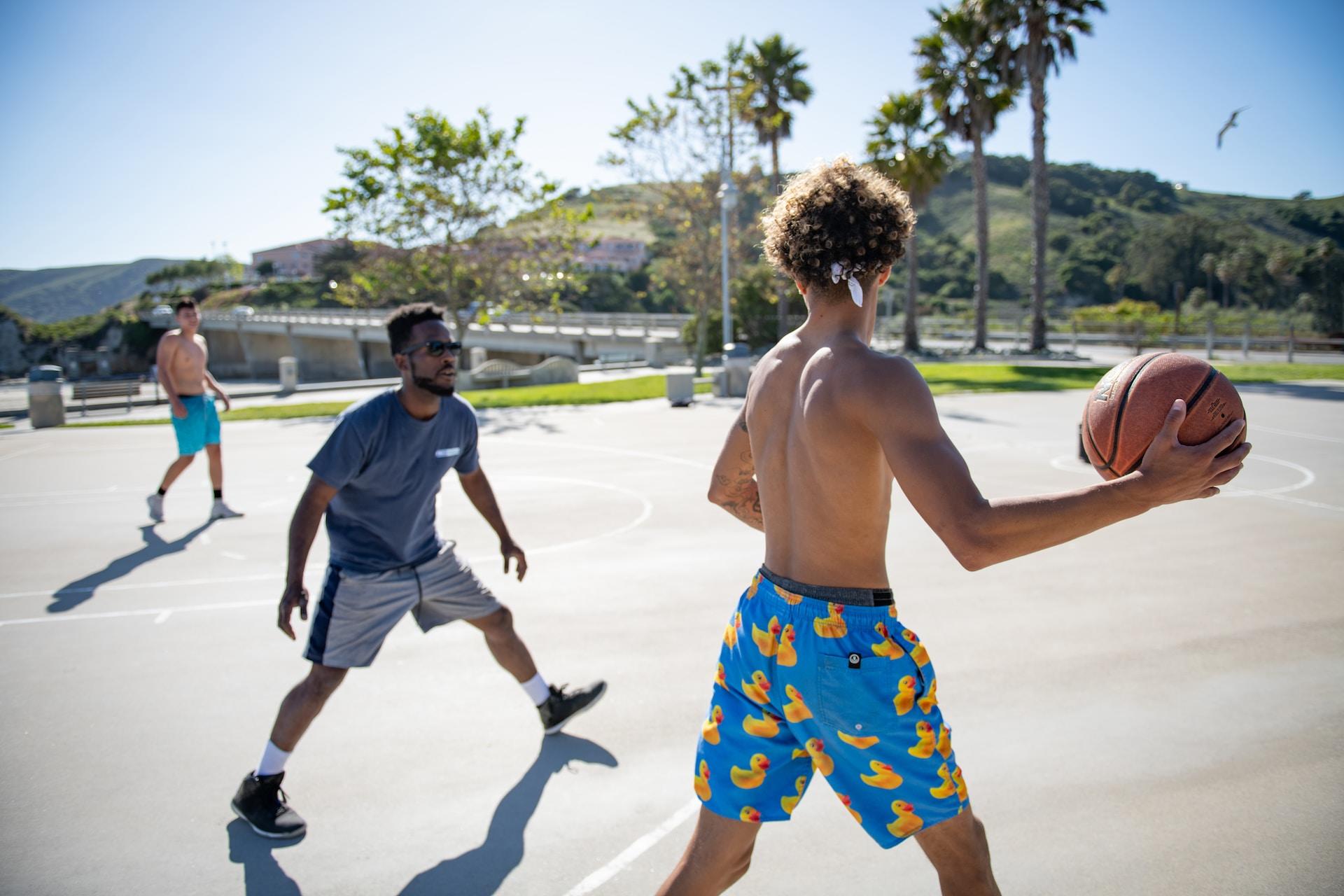 People playing basketball casually.