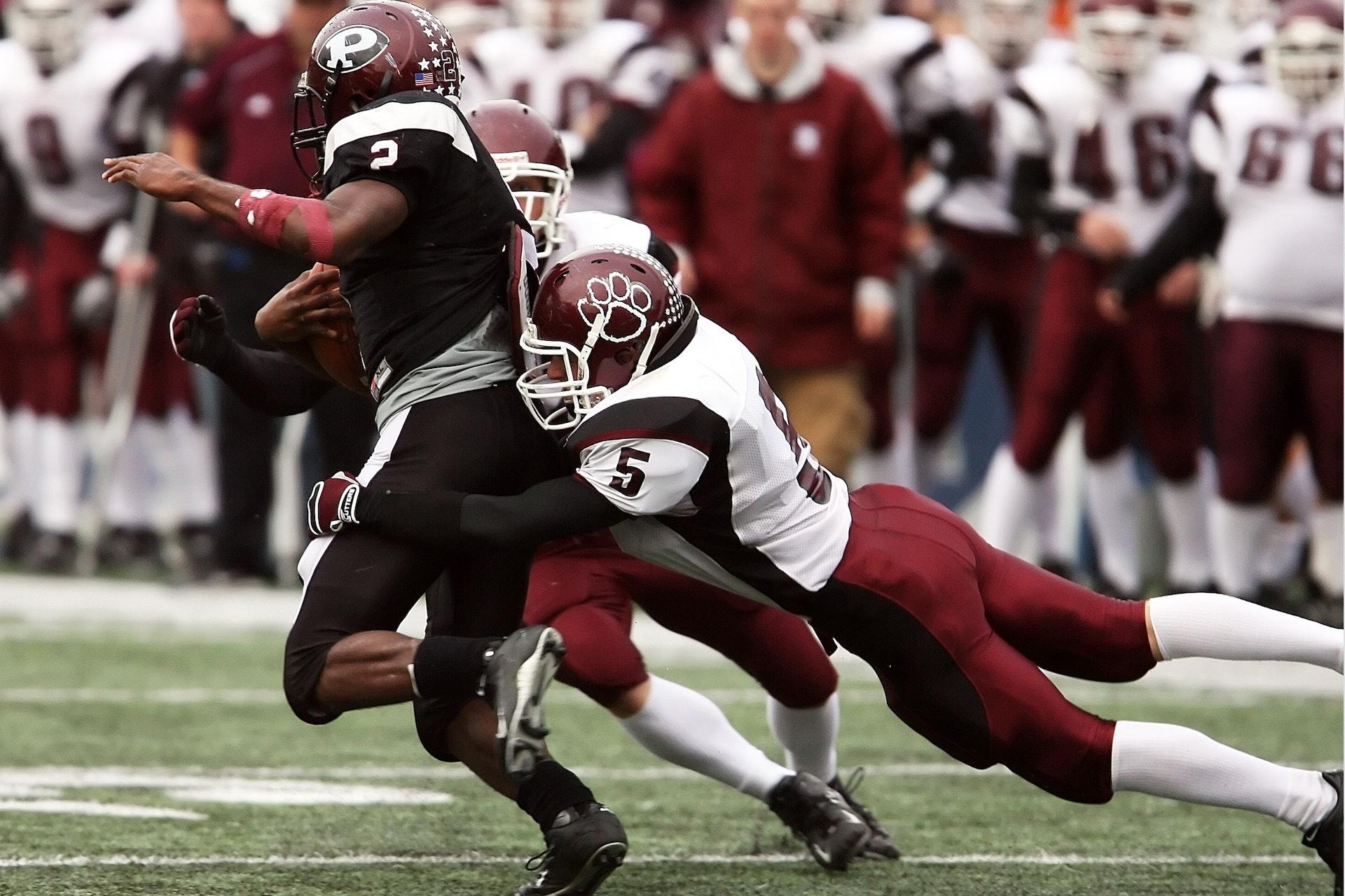A person getting brutal hits during the game.