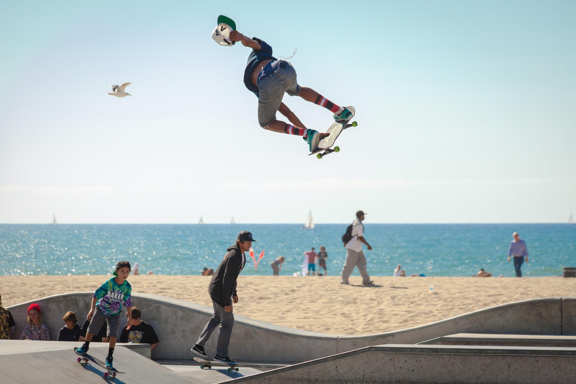 A skateboarder jumping high into the air.