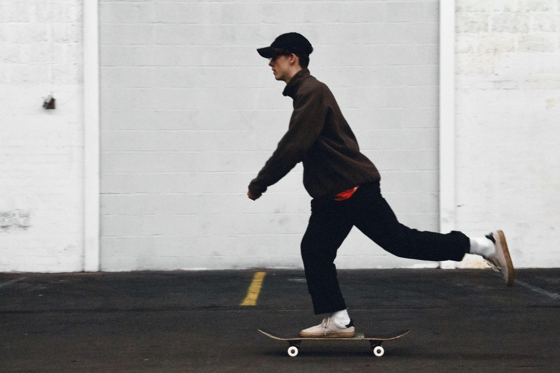 A skateboarder pushing off.