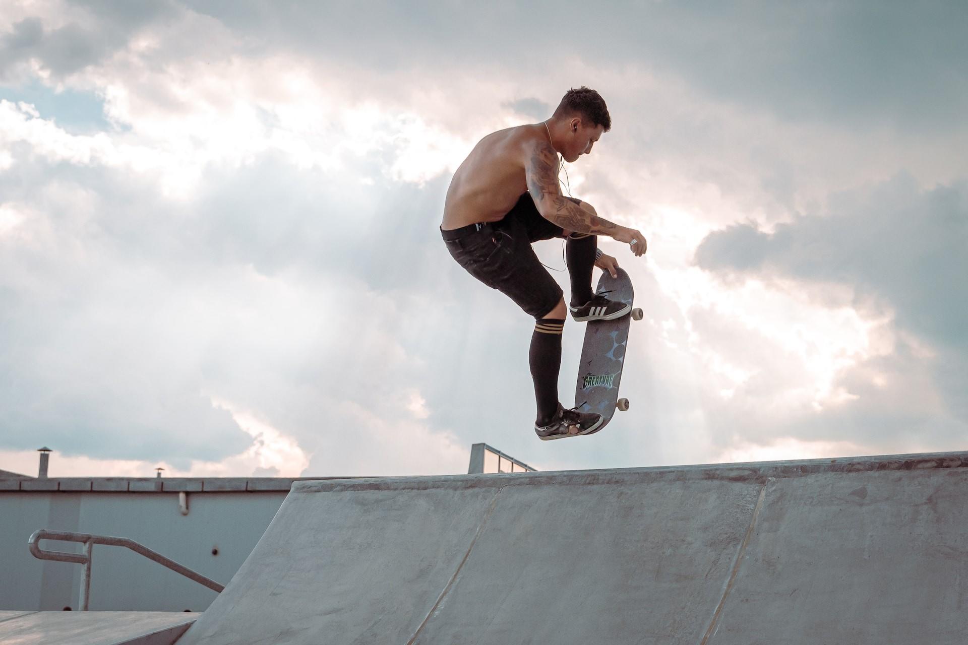 A skateboarder jumping up a ramp.
