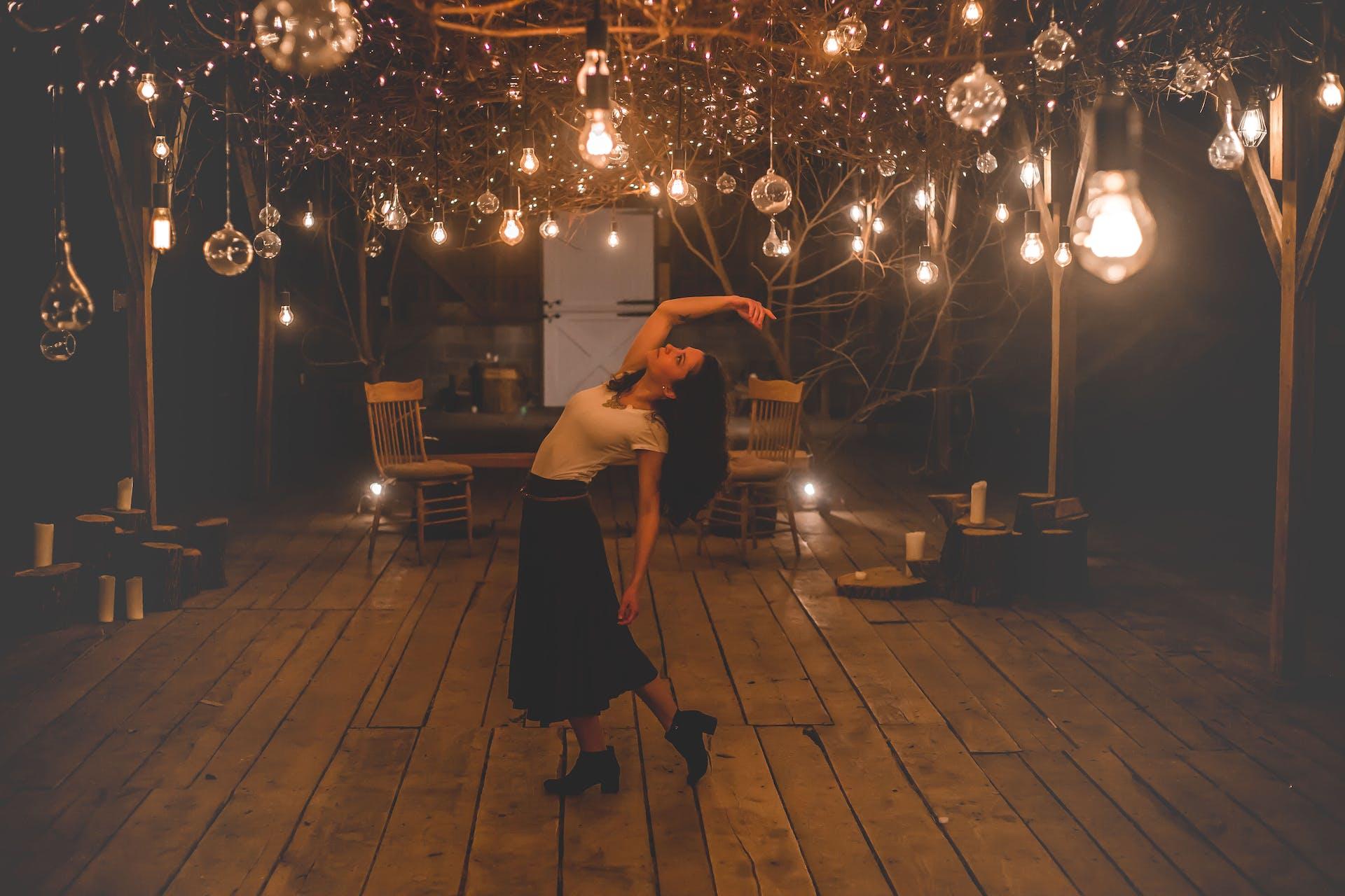 A girl dancing away in the night.