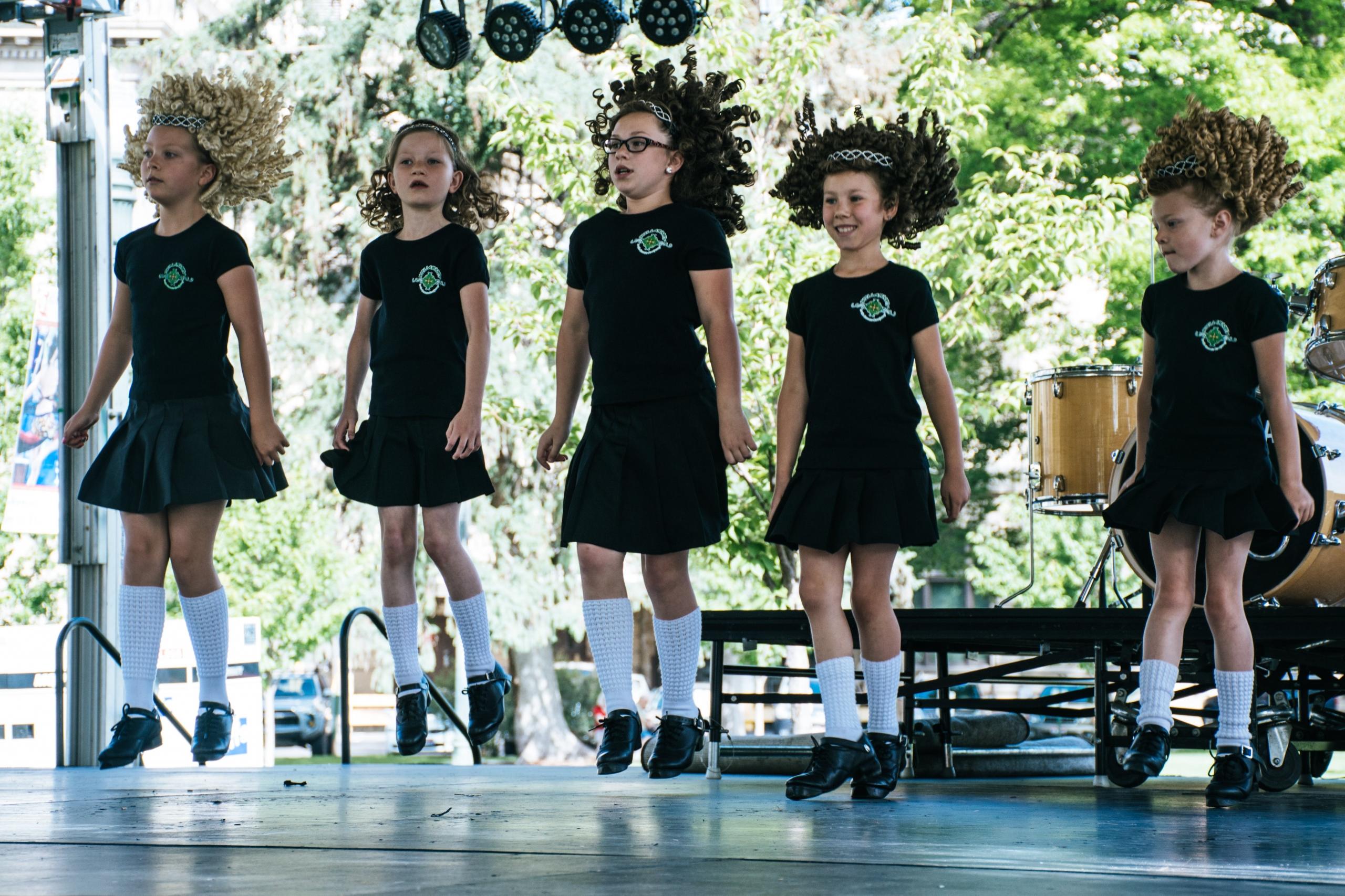 A group of children practicing tap dance.