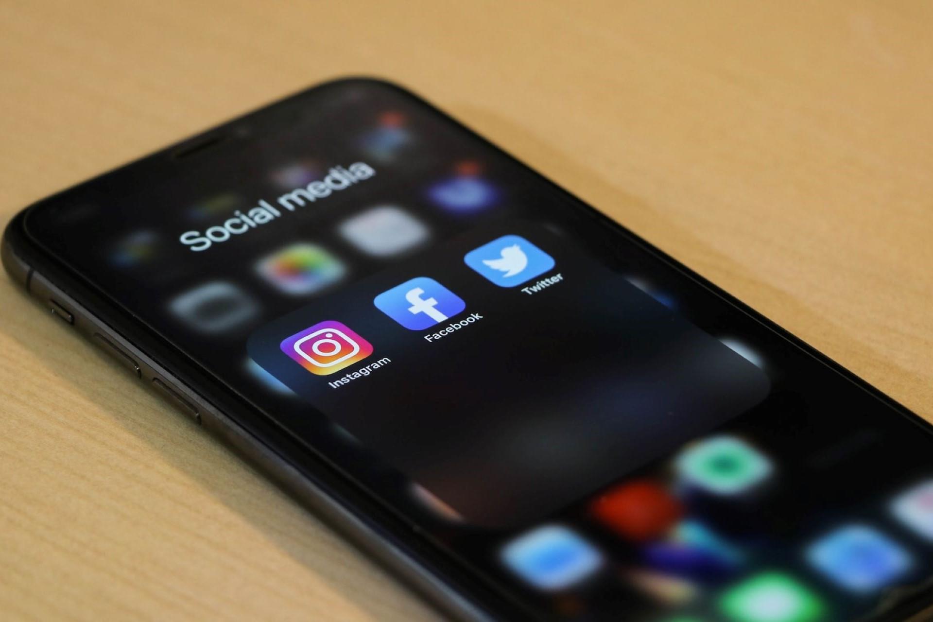 A smartphone with the social media folder open.