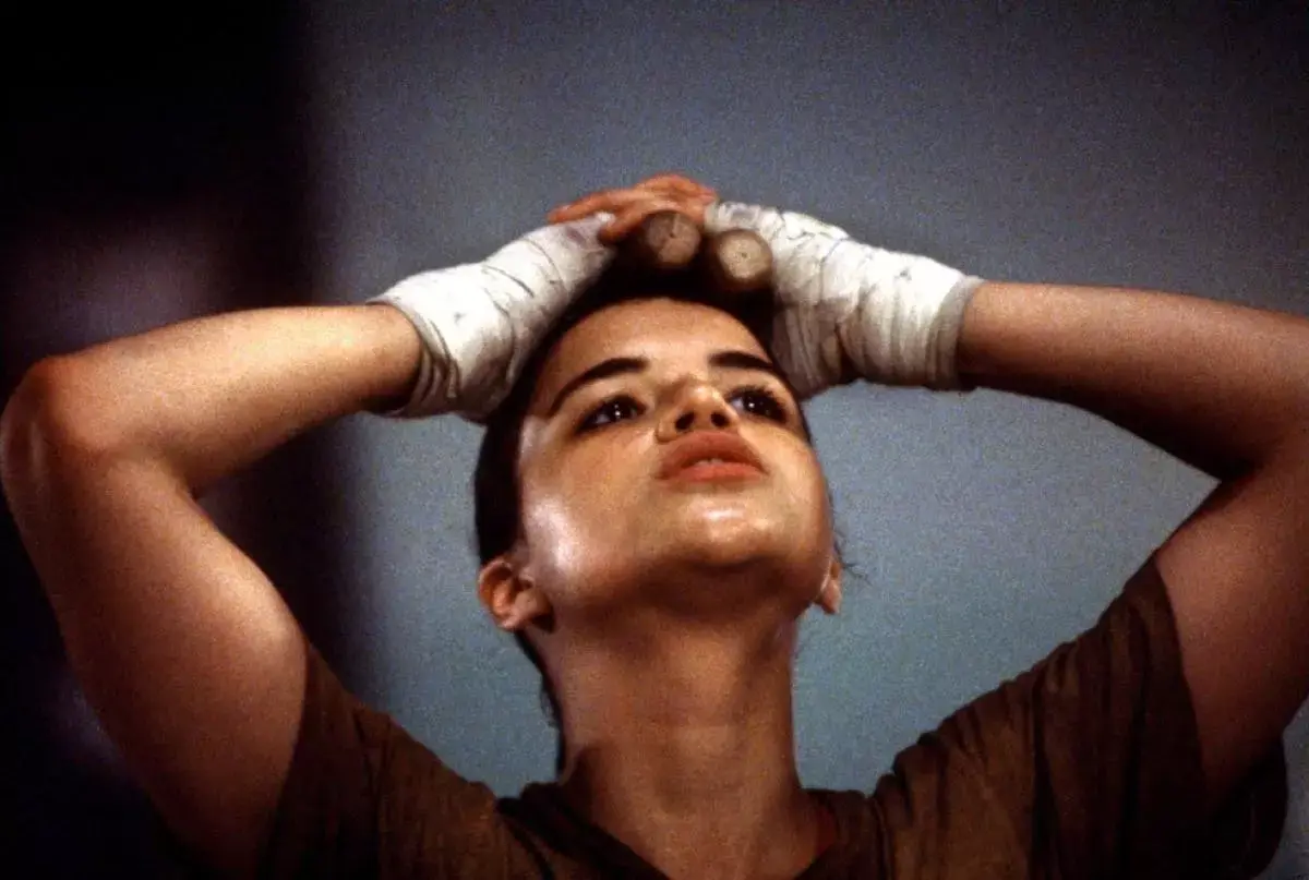 female boxer holding her hands above her head from film girlfight