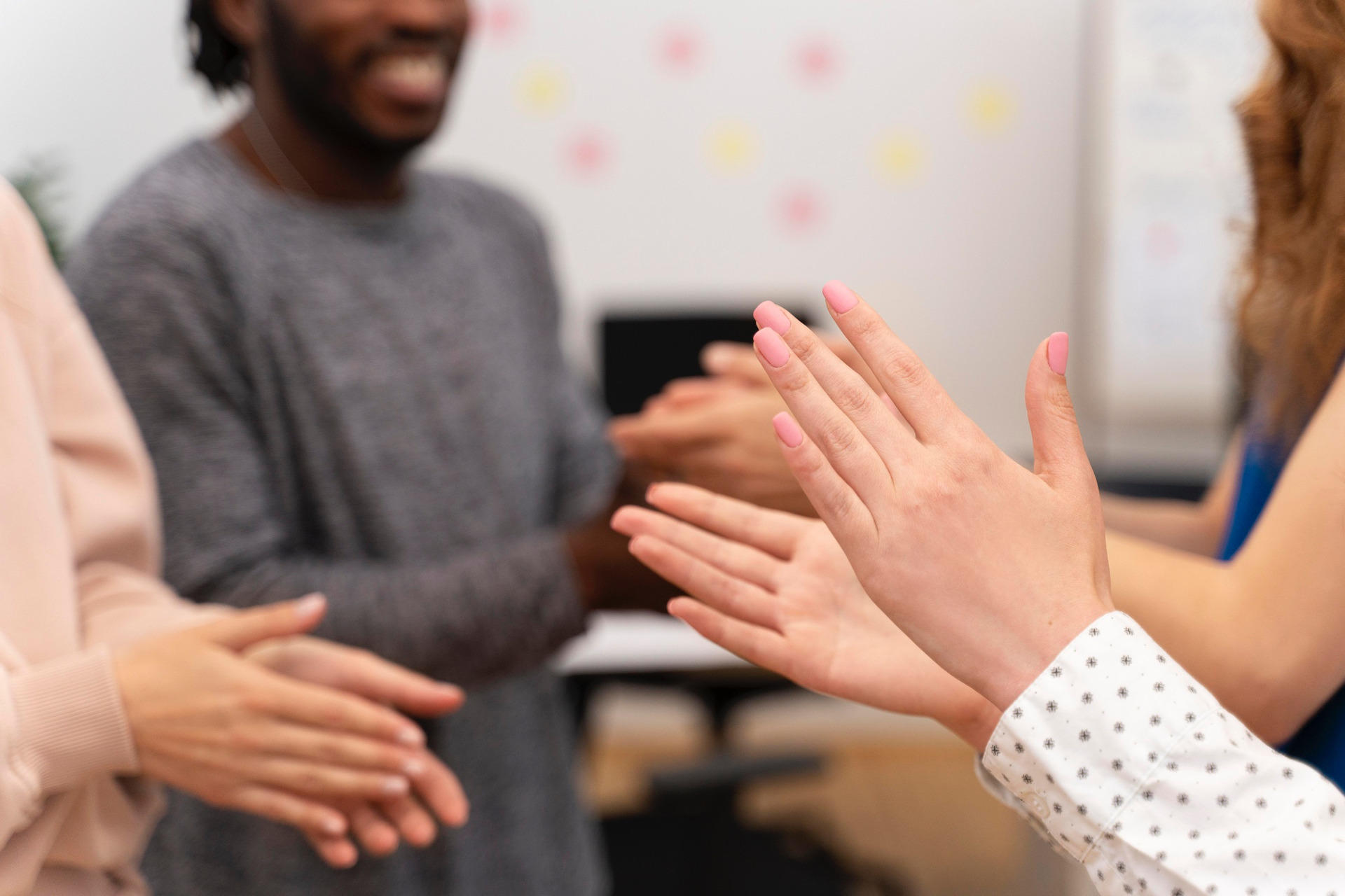 A female tutor giving lesson in ASL.